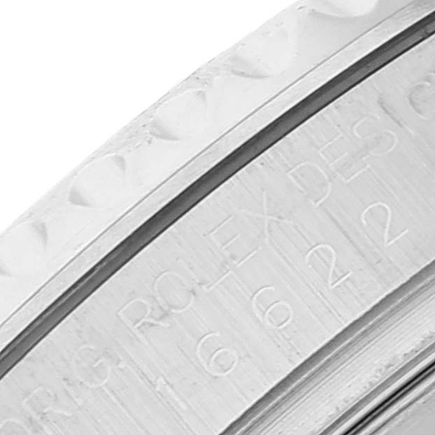 This image shows a close-up of the bezel and engraved inner ring of a Rolex Yacht-Master 16622 Men
s Stainless Steel Silver Dial 16622 Men
s Stainless Steel Silver Dial watch.