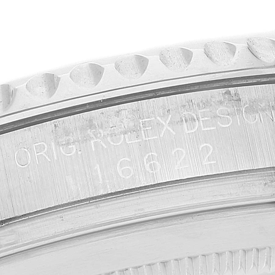 The image shows a close-up of the engraved bezel and side case of a Rolex Yacht-Master 16622 Men
s Stainless Steel Silver Dial 16622 Men
s Stainless Steel Silver Dial watch.