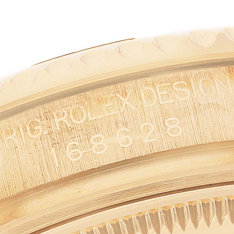 This close-up image shows the engraved side of the bezel on a Rolex Yacht-Master 168628 Men
s Yellow Gold White Dial 168628 Men
s Yellow Gold White Dial watch.