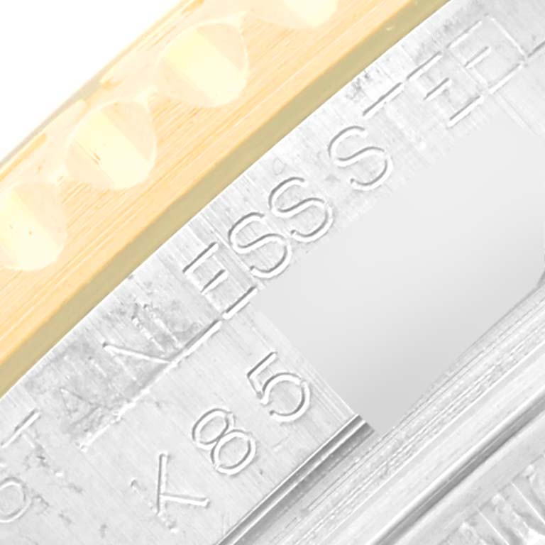 The image shows a close-up of the bezel and part of the case of a Rolex Yacht-Master 168623 Men's Steel and Gold (two tone) White Dial 168623 Men's Steel and Gold (two tone) White Dial watch, highlighting the stainless steel and gold elements.