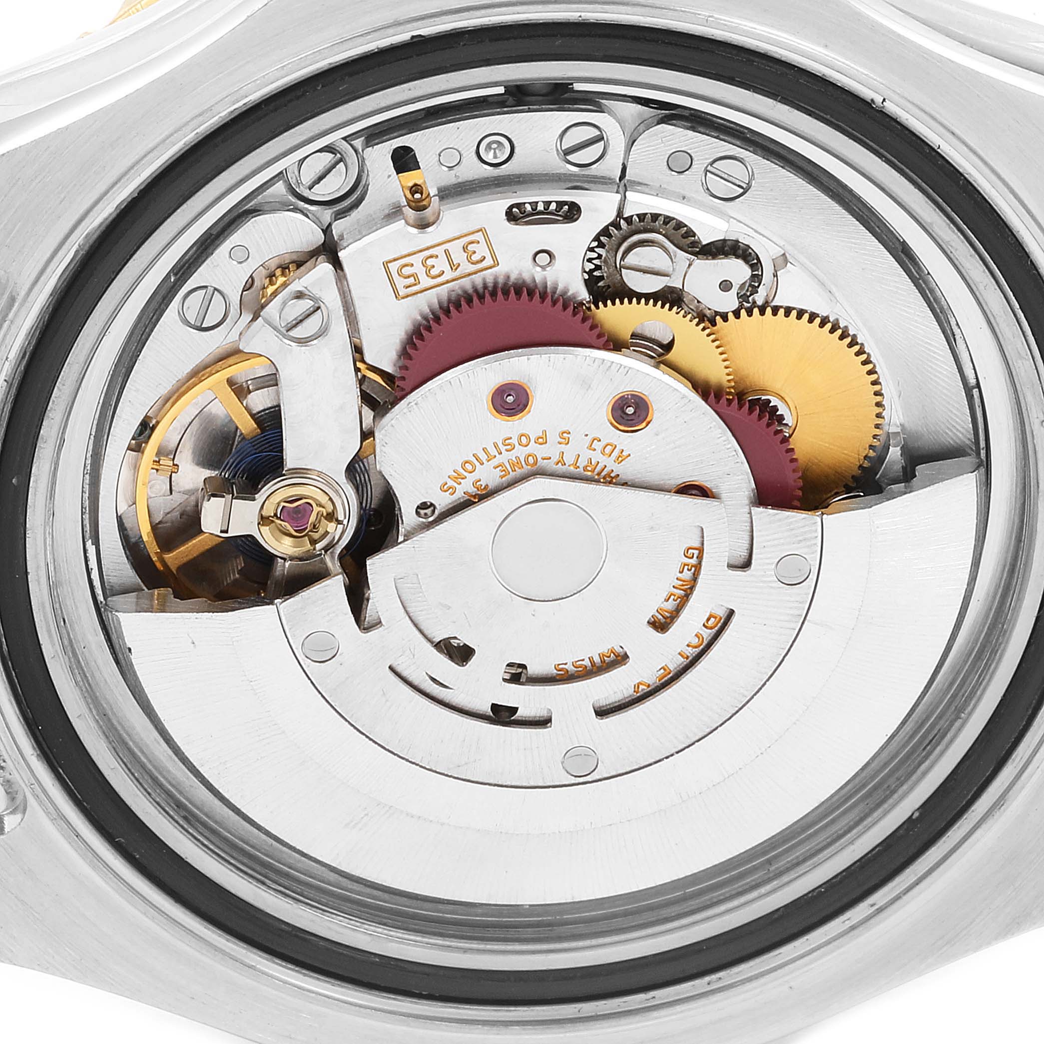 The image shows the internal movement mechanism of a Rolex Yacht-Master 16623 Men
s Steel and Gold (two tone) Grey Dial 16623 Men
s Steel and Gold (two tone) Grey Dial watch from a back view angle.