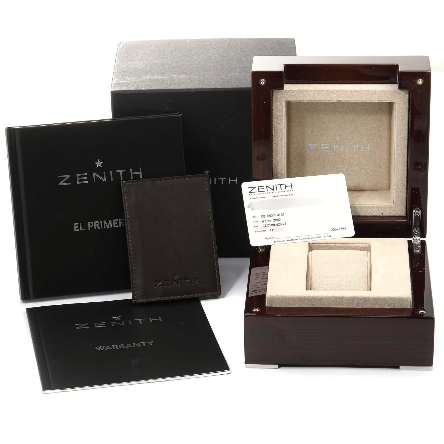 This image shows the accessories for a Zenith El Primero 02.0500.420 Men's Stainless Steel Black Dial 02.0500.420 Men's Stainless Steel Black Dial watch, including the watch box, warranty card, and user manuals.
