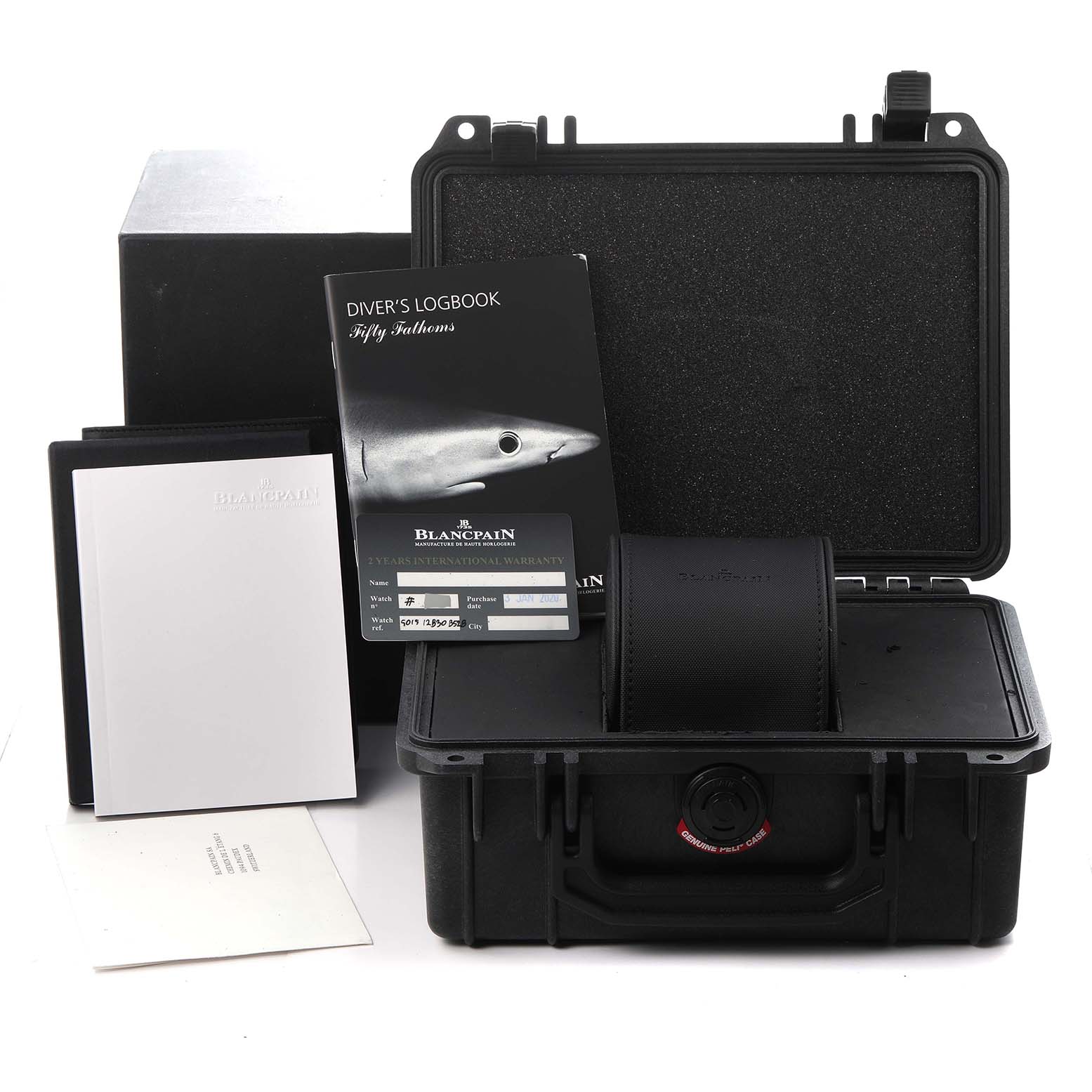 The image shows packaging and accessories for the Blancpain Fifty Fathoms 5015-12B30 Men
s Titanium Black Dial 5015-12B30 Men
s Titanium Black Dial, including a diver
s logbook, warranty card, and a protective case.