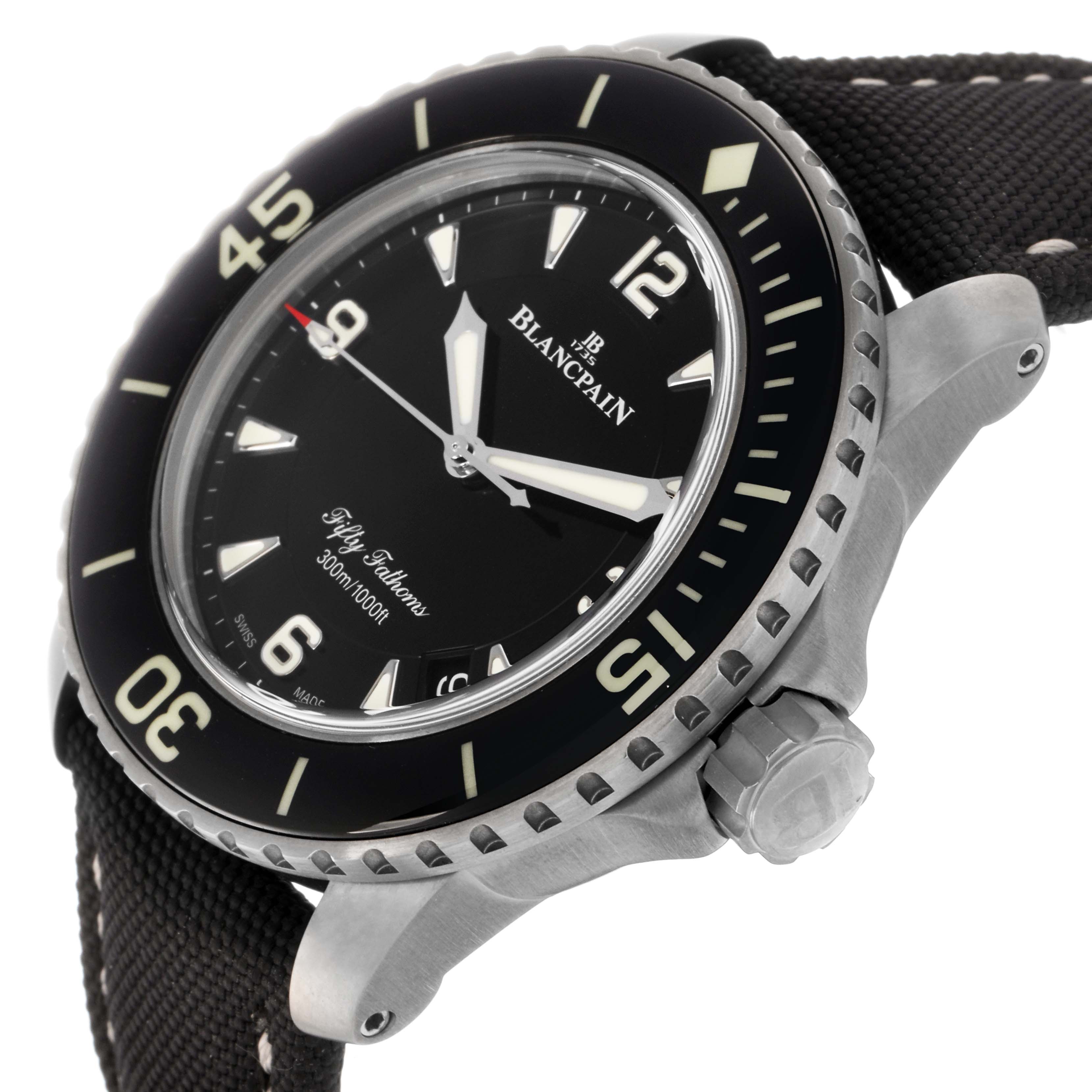 The Blancpain Fifty Fathoms 5015-12B30 Men
s Titanium Black Dial 5015-12B30 Men
s Titanium Black Dial watch is shown at an angle highlighting the bezel, crown, face, and part of the strap.