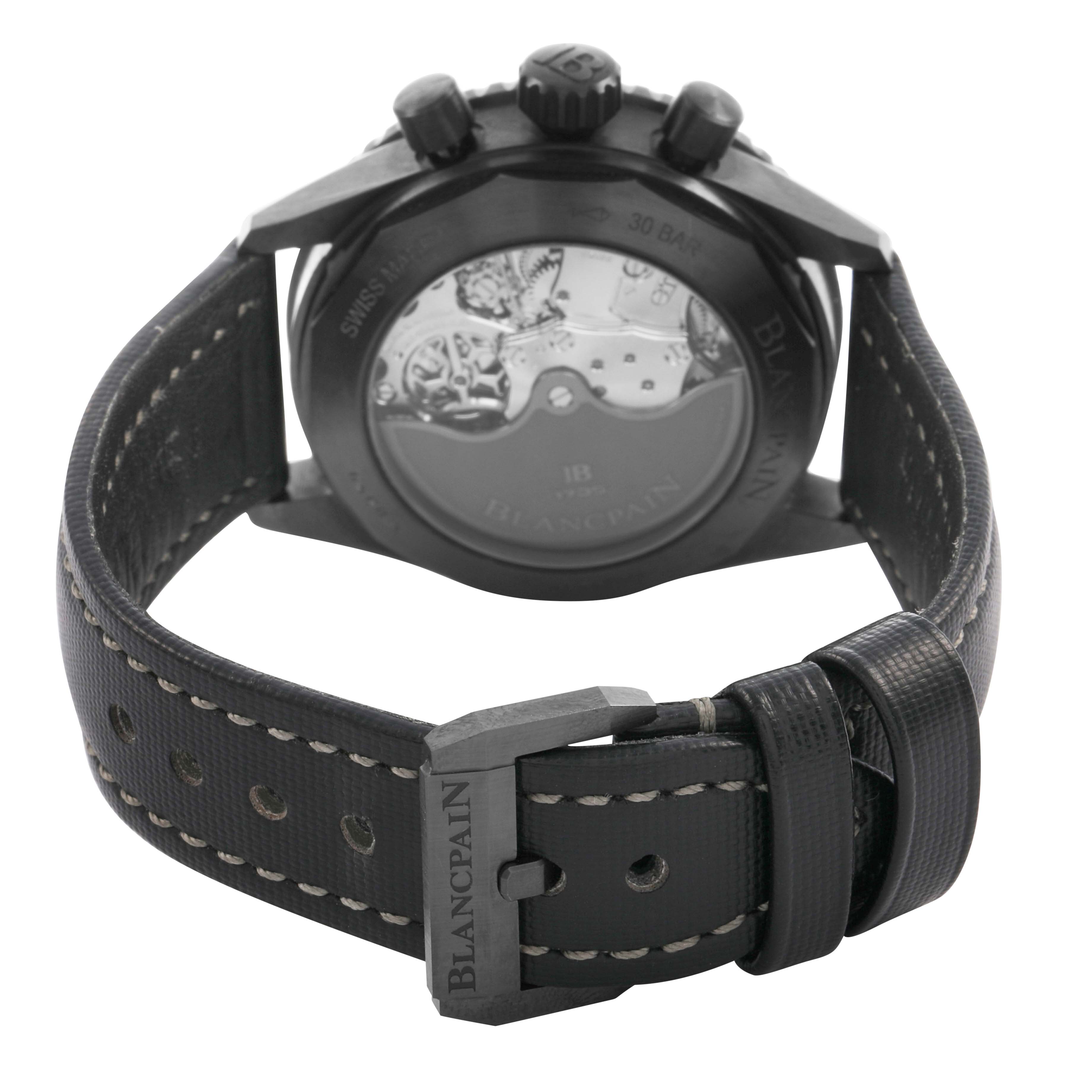 The Blancpain Fifty Fathoms 5200-0153-B52A Men's Ceramic Green Dial watch is shown from the back, highlighting the case back, movement, and leather strap with stitching.
