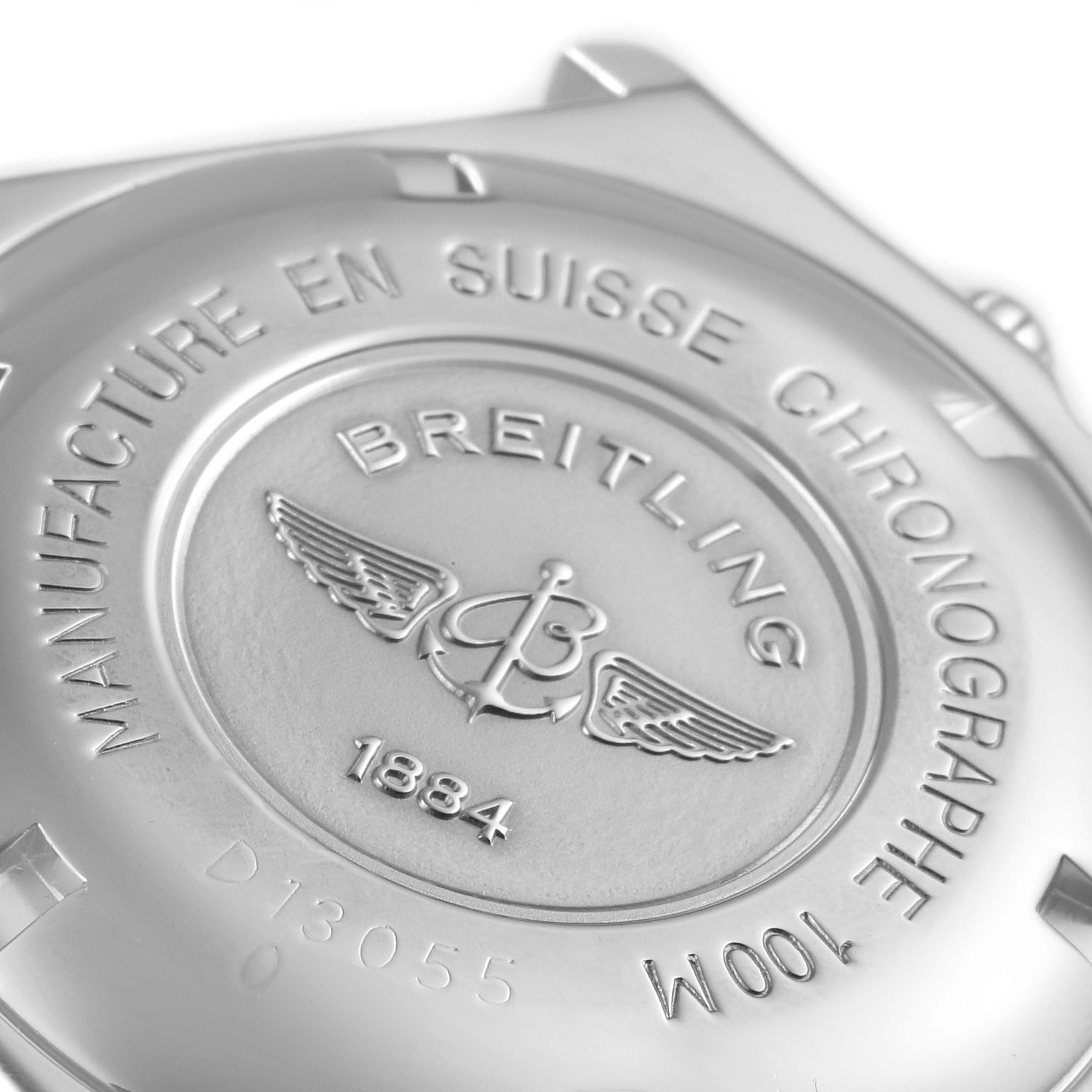 The image shows the back case of a Breitling Chronomat D13055 Men's Steel and Gold (two tone) White Dial D13055 Men's Steel and Gold (two tone) White Dial watch, featuring brand markings and model details.