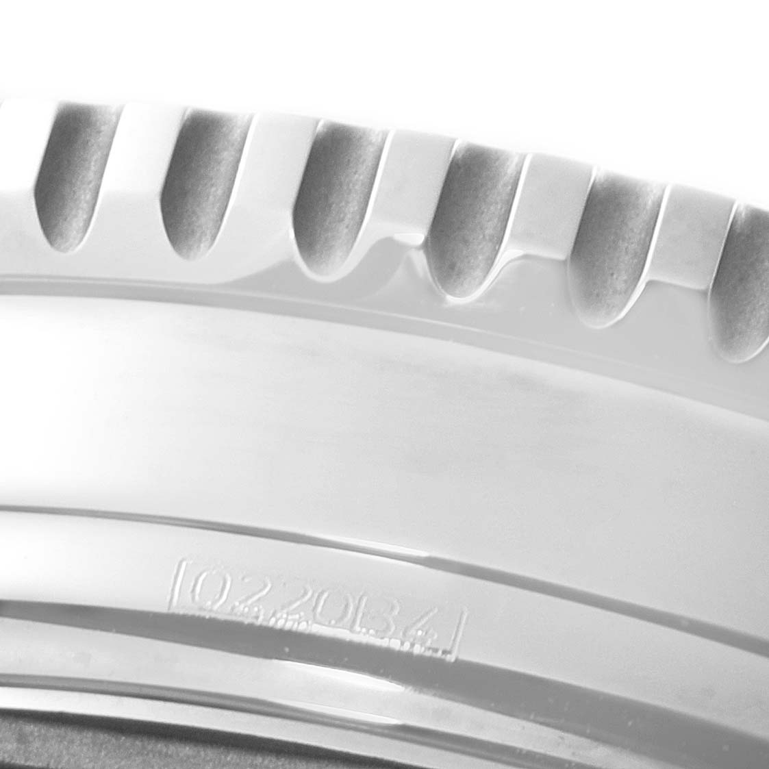 The image shows a close-up of the bezel edge and part of the casing of a Breitling Navitimer A13324 Men
s Stainless Steel Black Dial A13324 Men
s Stainless Steel Black Dial watch.