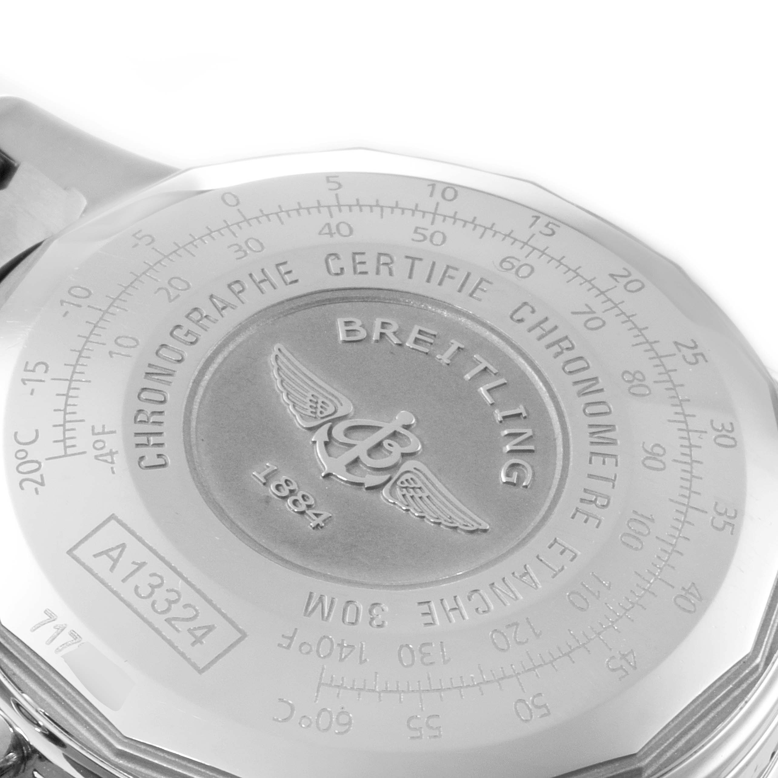 The image shows the back case of a Breitling Navitimer A13324 Men
s Stainless Steel Black Dial A13324 Men
s Stainless Steel Black Dial watch at a close-up angle, highlighting its engraved details.