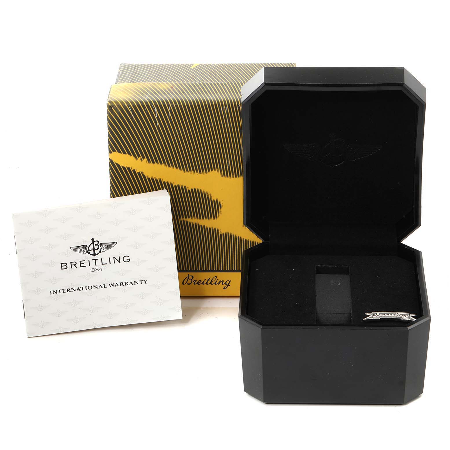 The image shows the packaging and accessories for a Breitling Navitimer A13022 Men
s Stainless Steel Black Dial A13022 Men
s Stainless Steel Black Dial watch, including the box and international warranty card.