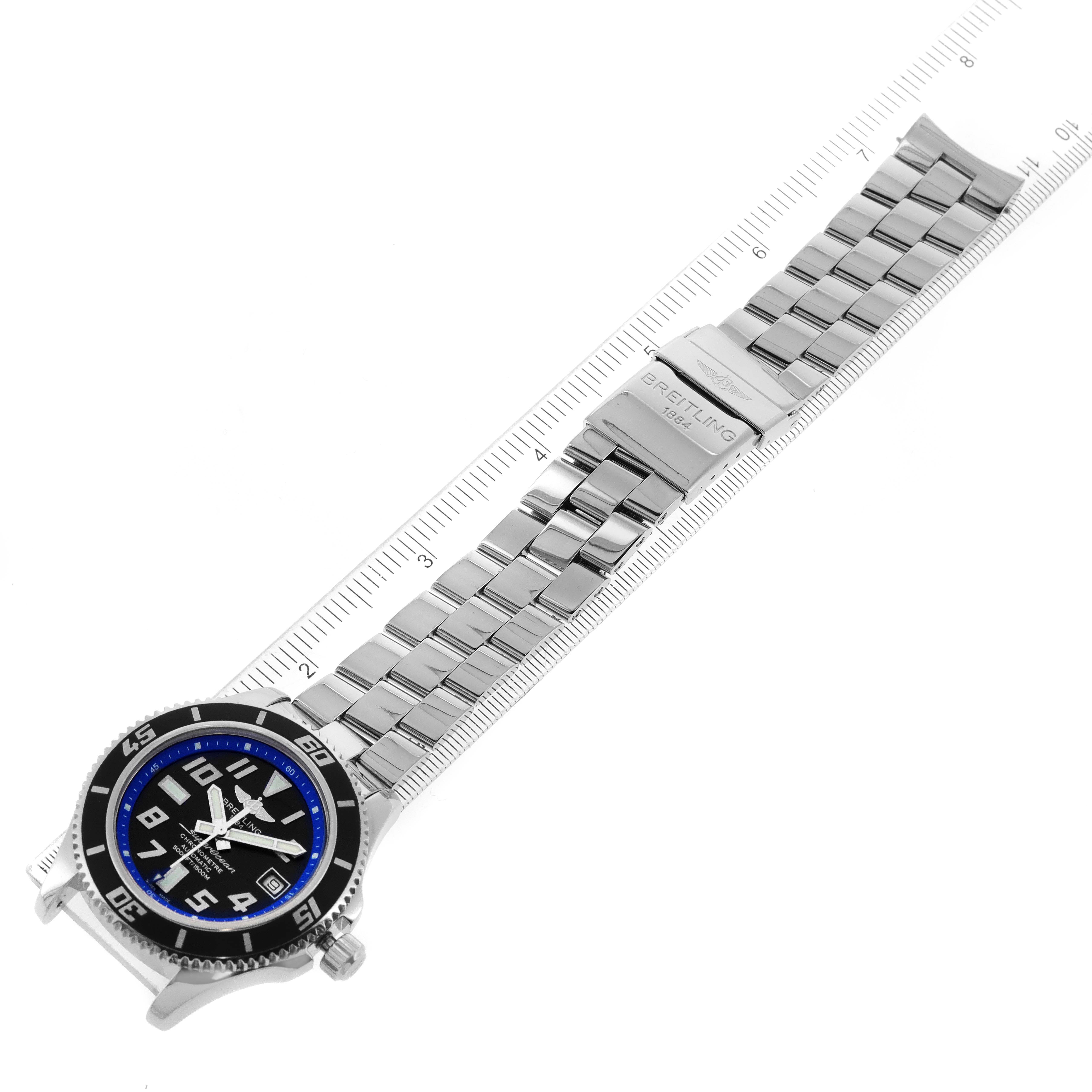 This image shows a Breitling Superocean A17364 Men
s Stainless Steel Black Dial A17364 Men
s Stainless Steel Black Dial watch laid flat, showcasing its dial, bezel, and metal bracelet with clasp.