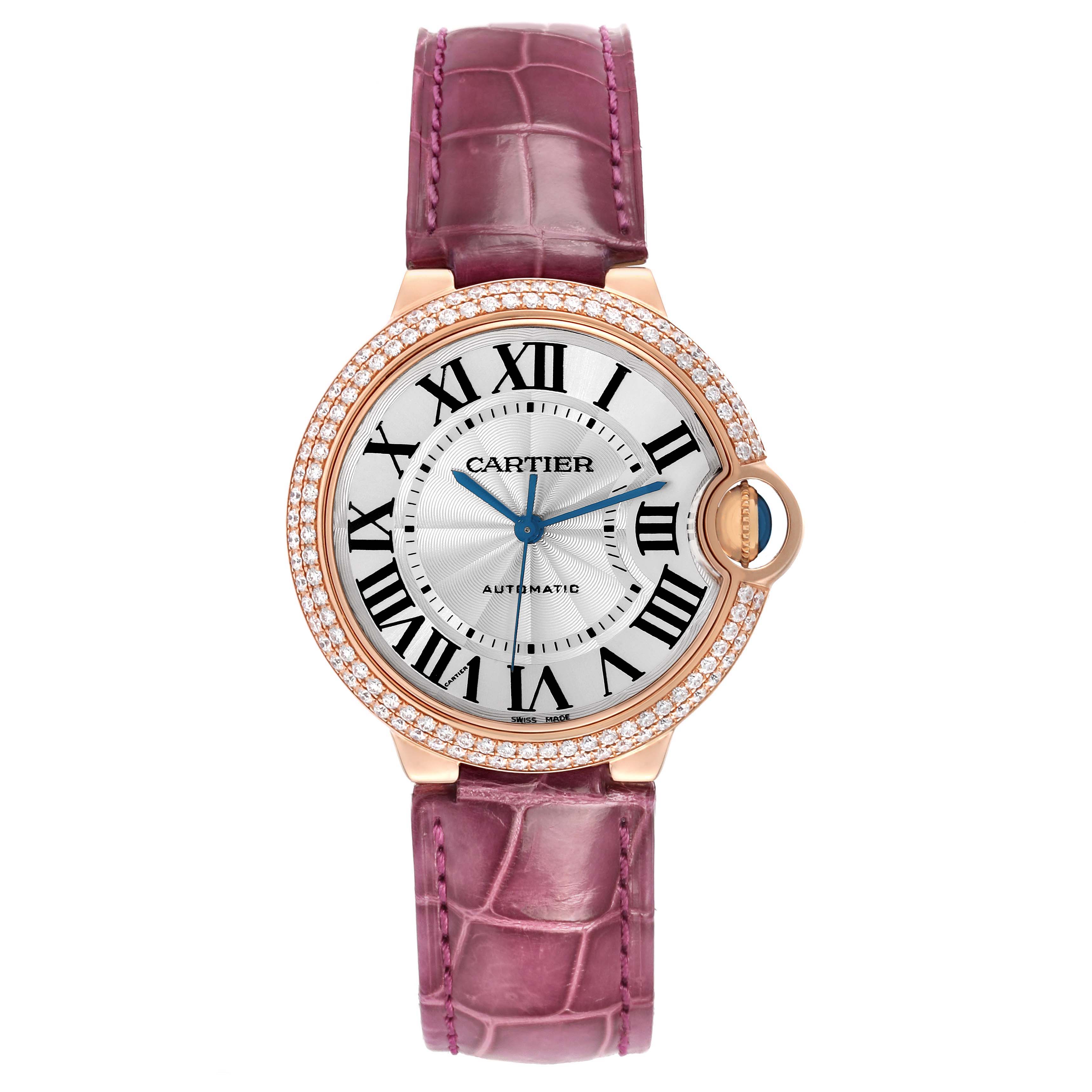 The Ballon Bleu de Cartier watch is shown from a top view, displaying the dial, crown, and pink strap.