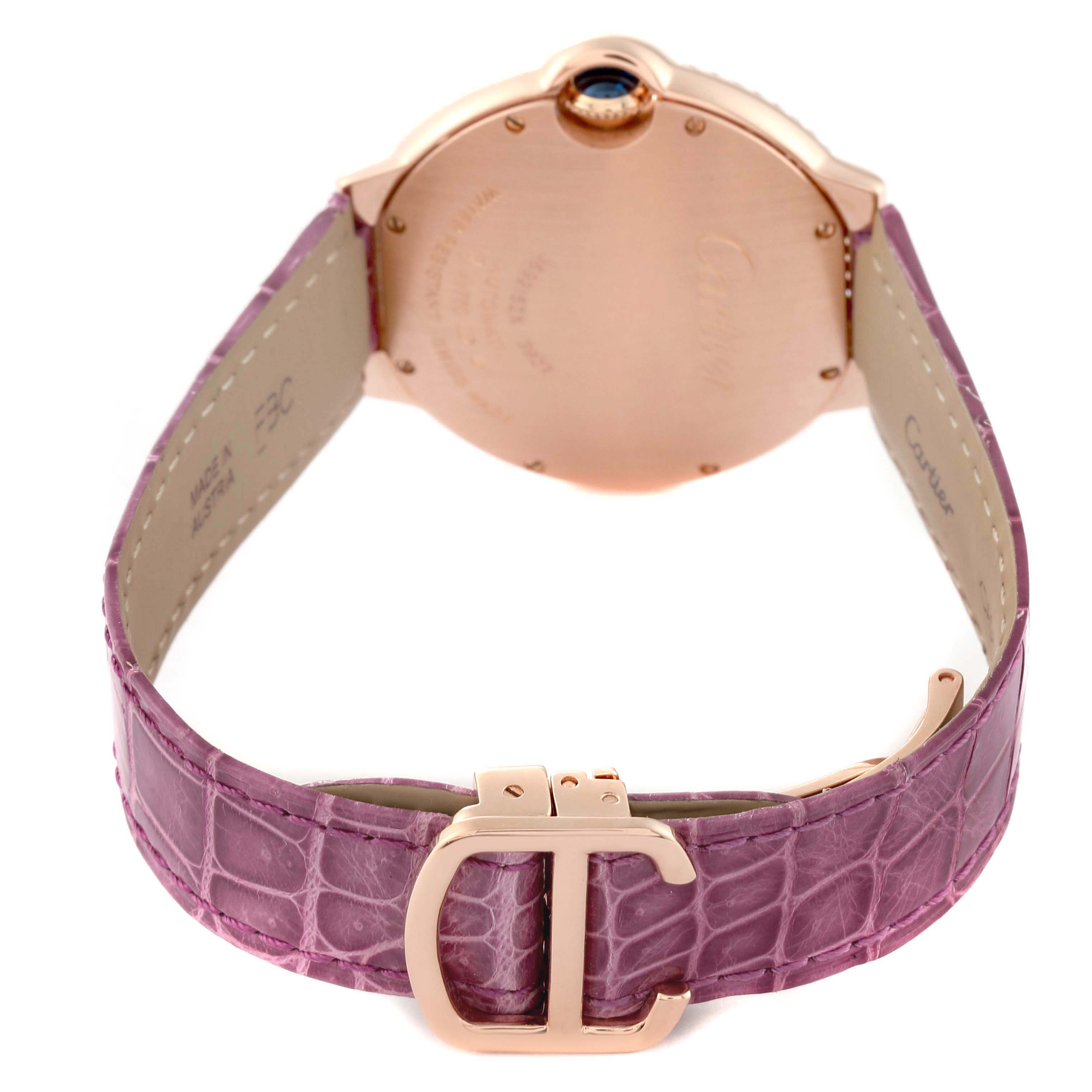 The image shows the back view of a Cartier Ballon Bleu WE900551 Men's Rose Gold Silver Dial watch, featuring its case back and purple leather strap with a clasp.