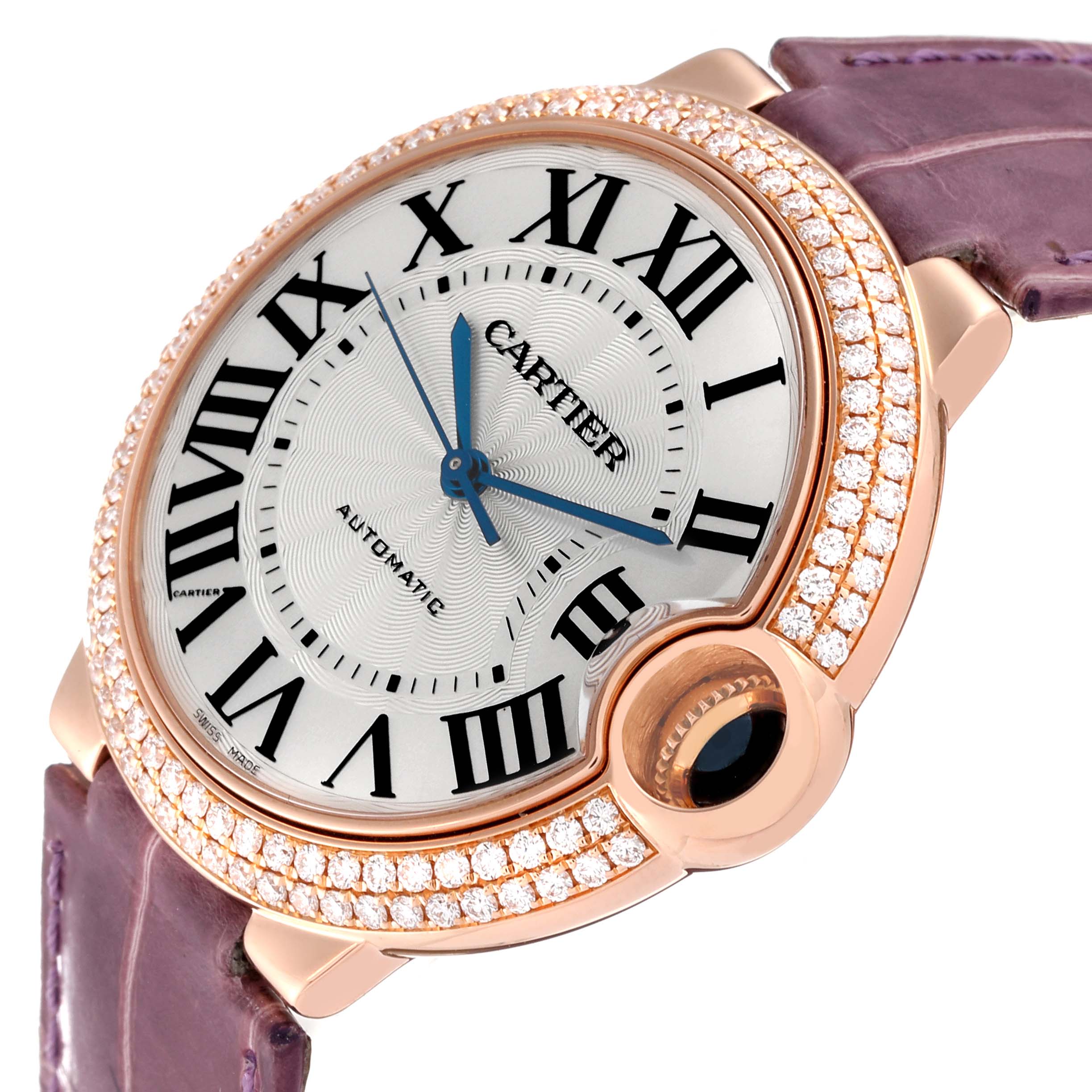 The image shows a close-up view of the Cartier Ballon Bleu WE900551 Women's Rose Gold Silver Dial WE900551 Women's Rose Gold Silver Dial watch face, highlighting its Roman numerals, blue hands, and diamond-encrusted bezel.