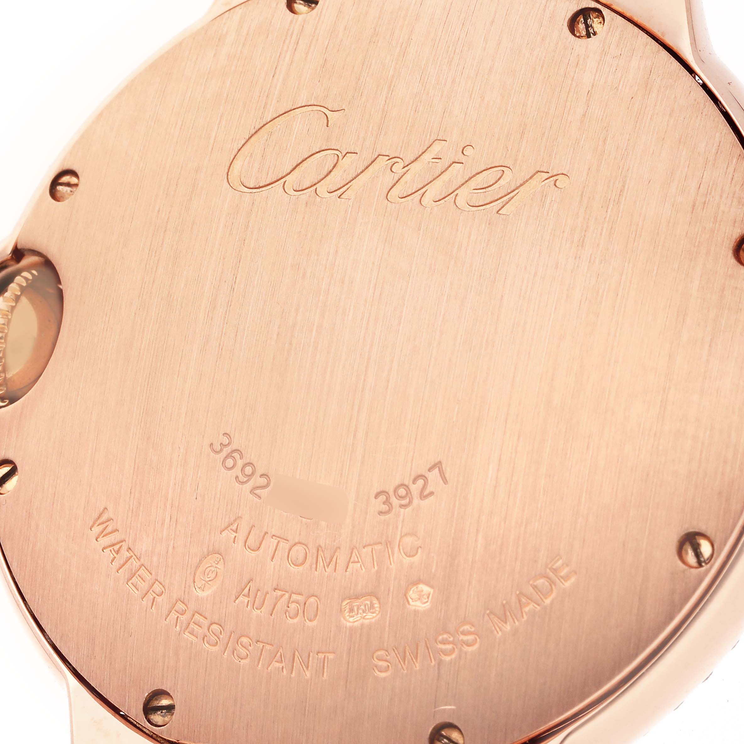 The image shows the engraved back of a Cartier Ballon Bleu WE900551 Women's Rose Gold Silver Dial WE900551 Women's Rose Gold Silver Dial watch, highlighting the brand name and specifications.