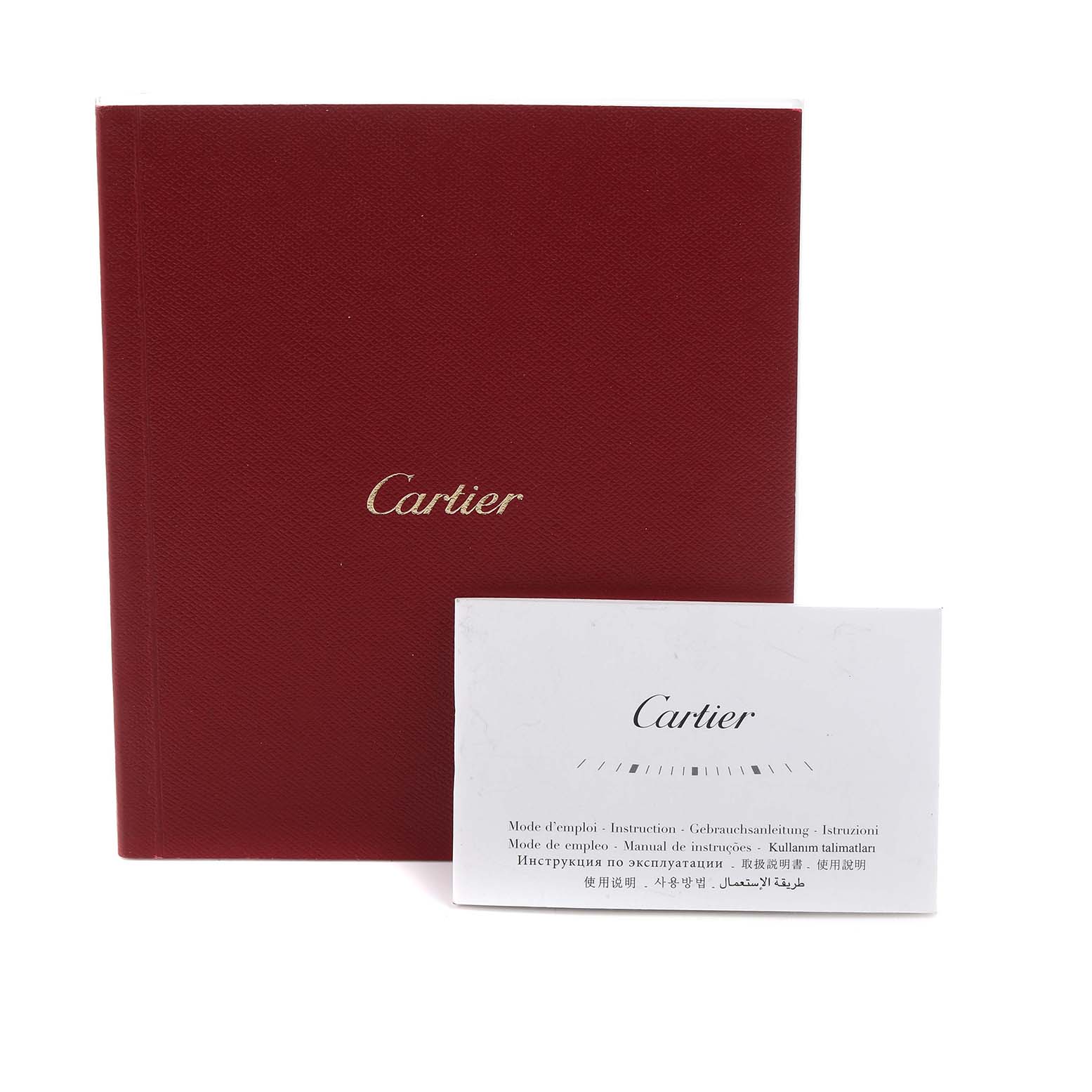 The image shows a Cartier manual and a booklet, likely accessories for the Ballon Bleu model watch.