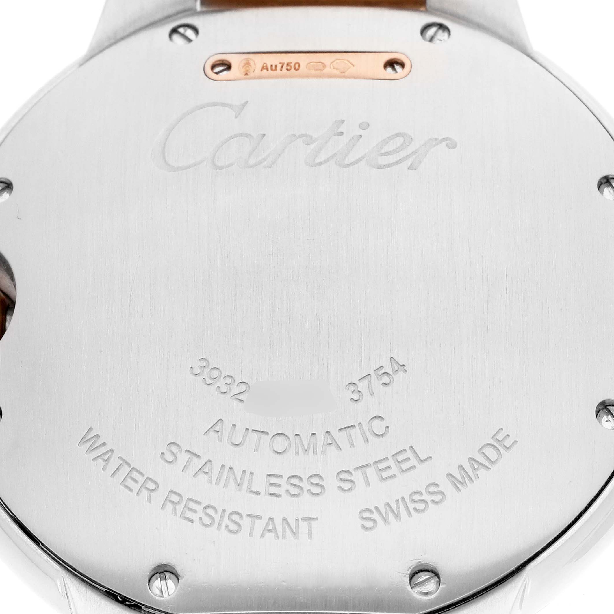 The image shows the back of the Cartier Ballon Bleu W2BB0003 Men
s Steel and Gold (two tone) Silver Dial W2BB0003 Men
s Steel and Gold (two tone) Silver Dial watch, displaying engravings and details like "Automatic" and "Stainless Steel."