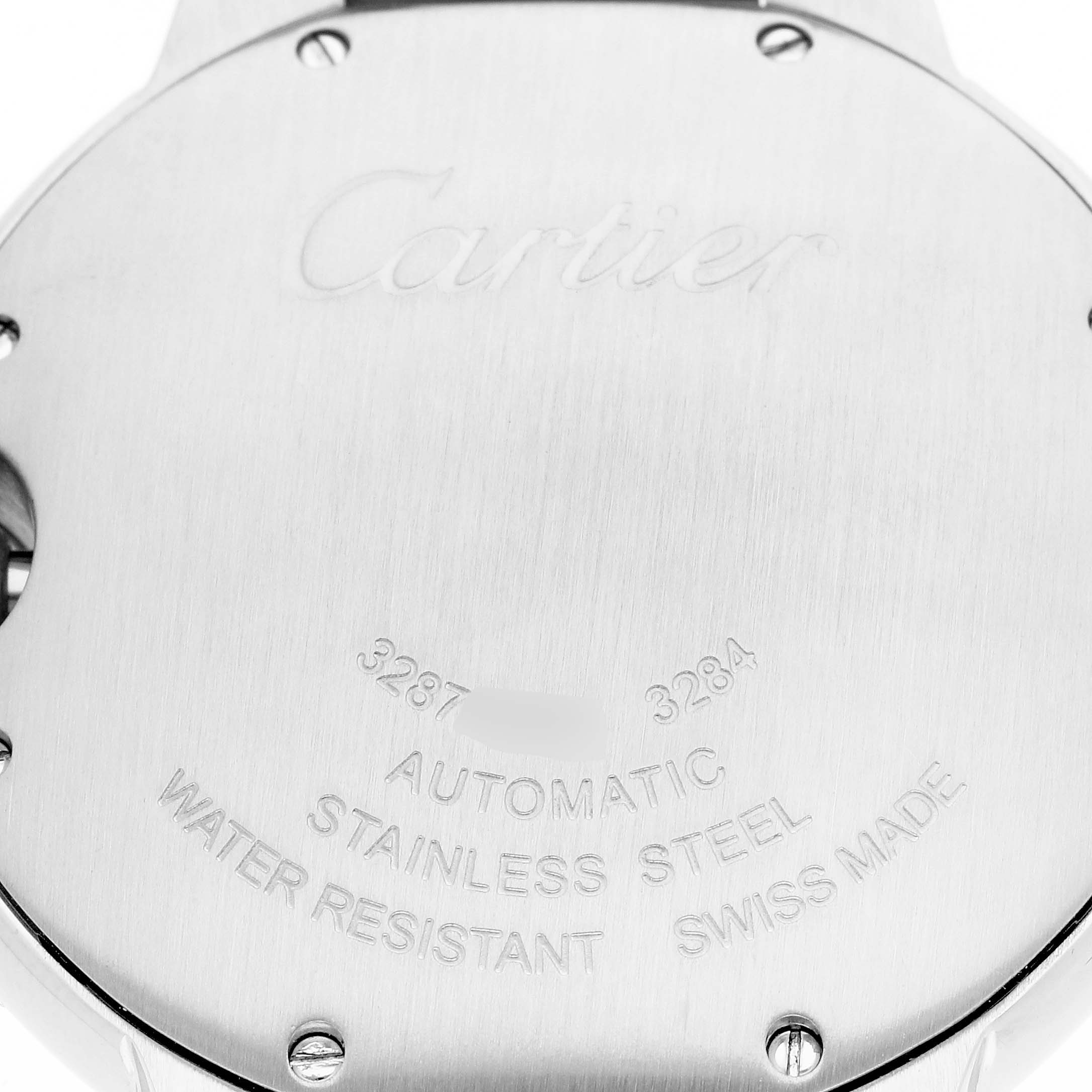 The image shows the back casing of a Cartier Ballon Bleu W6920033 Women
s Steel and Gold (two tone) Mother of Pearl Dial W6920033 Women
s Steel and Gold (two tone) Mother of Pearl Dial watch, highlighting the brand name, model details, and material information.