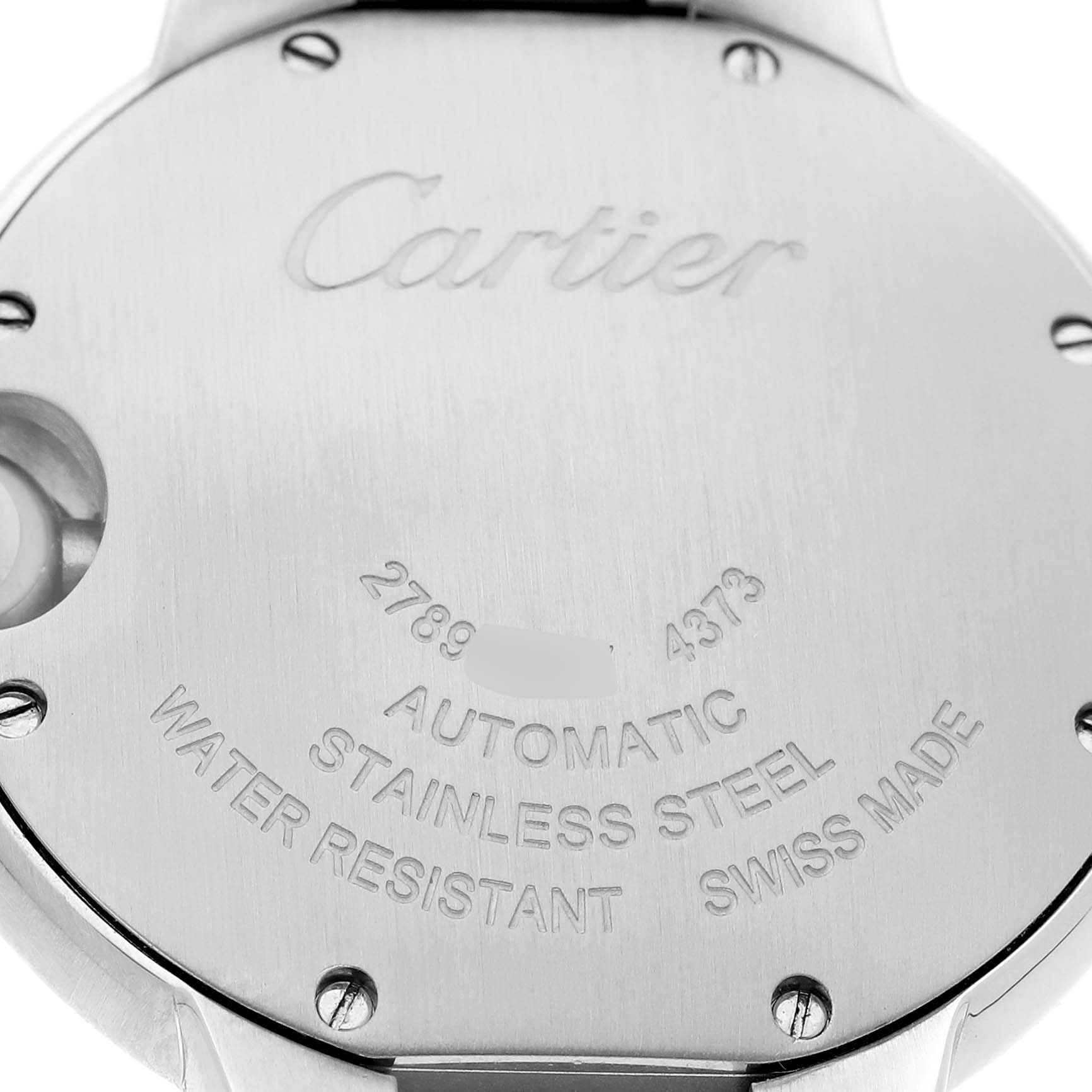 The image shows the back case of a Cartier Ballon Bleu W4BB0035 Women's Stainless Steel Silver Dial watch, displaying engravings and screws.