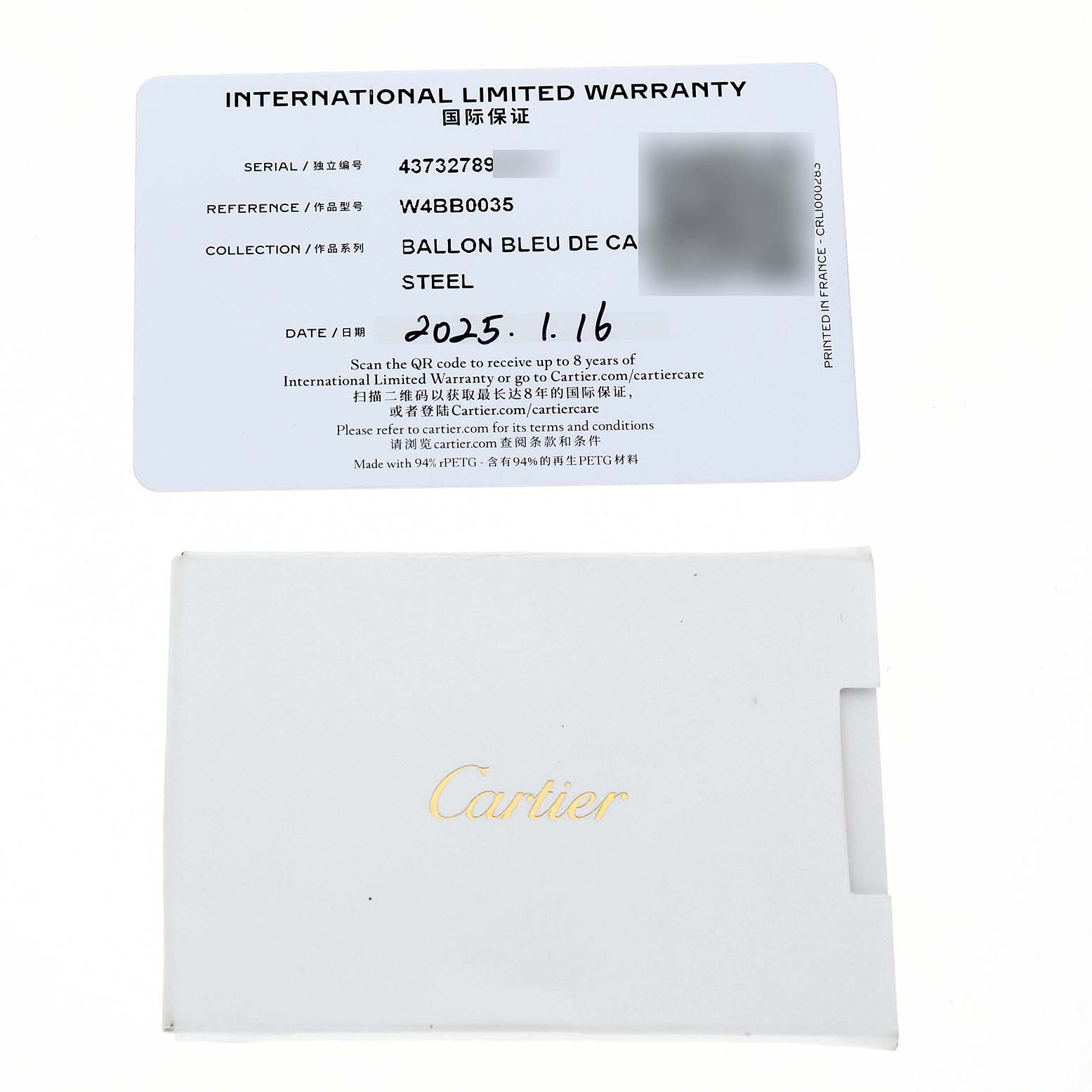 The image shows a Cartier Ballon Bleu W4BB0035 Women's Stainless Steel Silver Dial warranty card and a white envelope at a top-down angle.