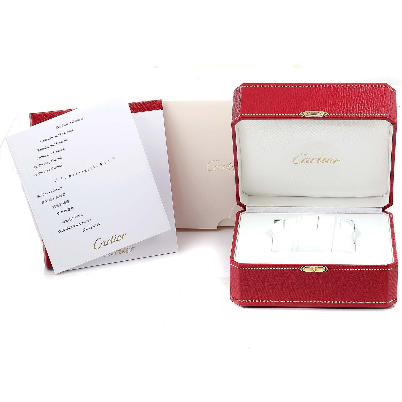 The image shows the packaging, including the red watch box and guarantee papers for the Drive de Cartier model by Cartier.