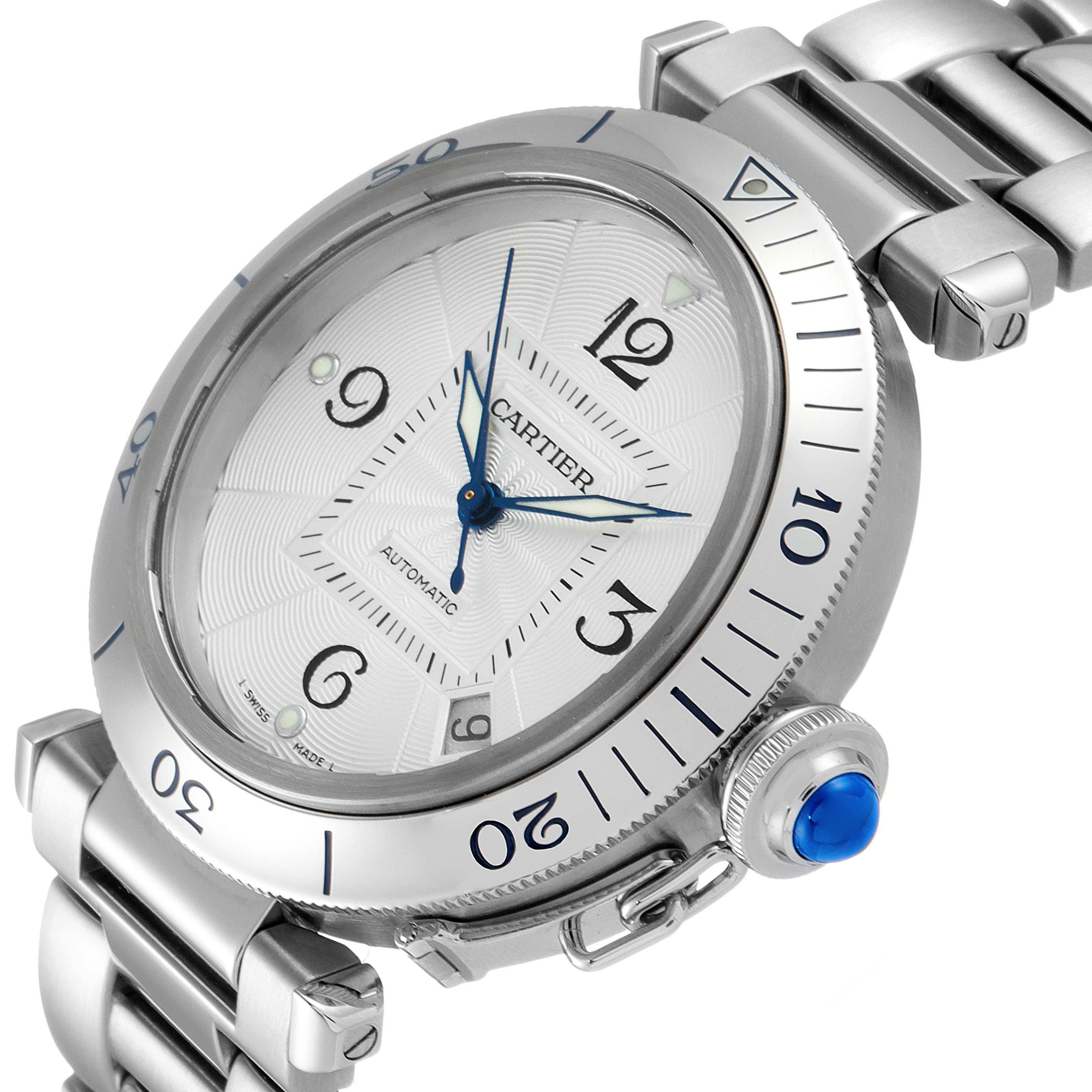 The image shows a Pasha de Cartier watch at a tilted angle, highlighting the face, numerals, bezel, crown, and part of the metal bracelet.