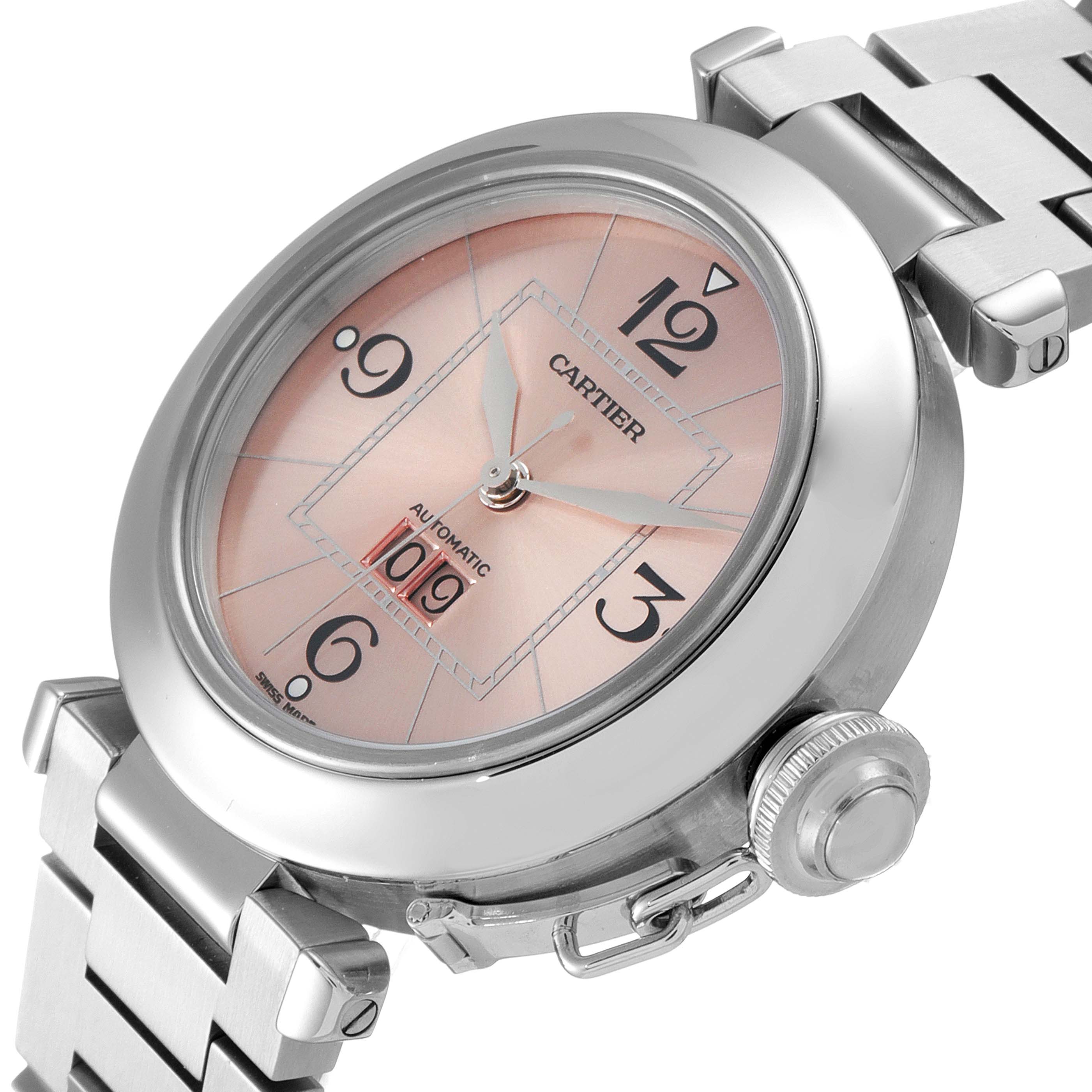 The image shows a side angle view of a Cartier Pasha W31058M7 Women's Stainless Steel Pink Dial W31058M7 Women's Stainless Steel Pink Dial watch, displaying its face, crown, and part of the bracelet.