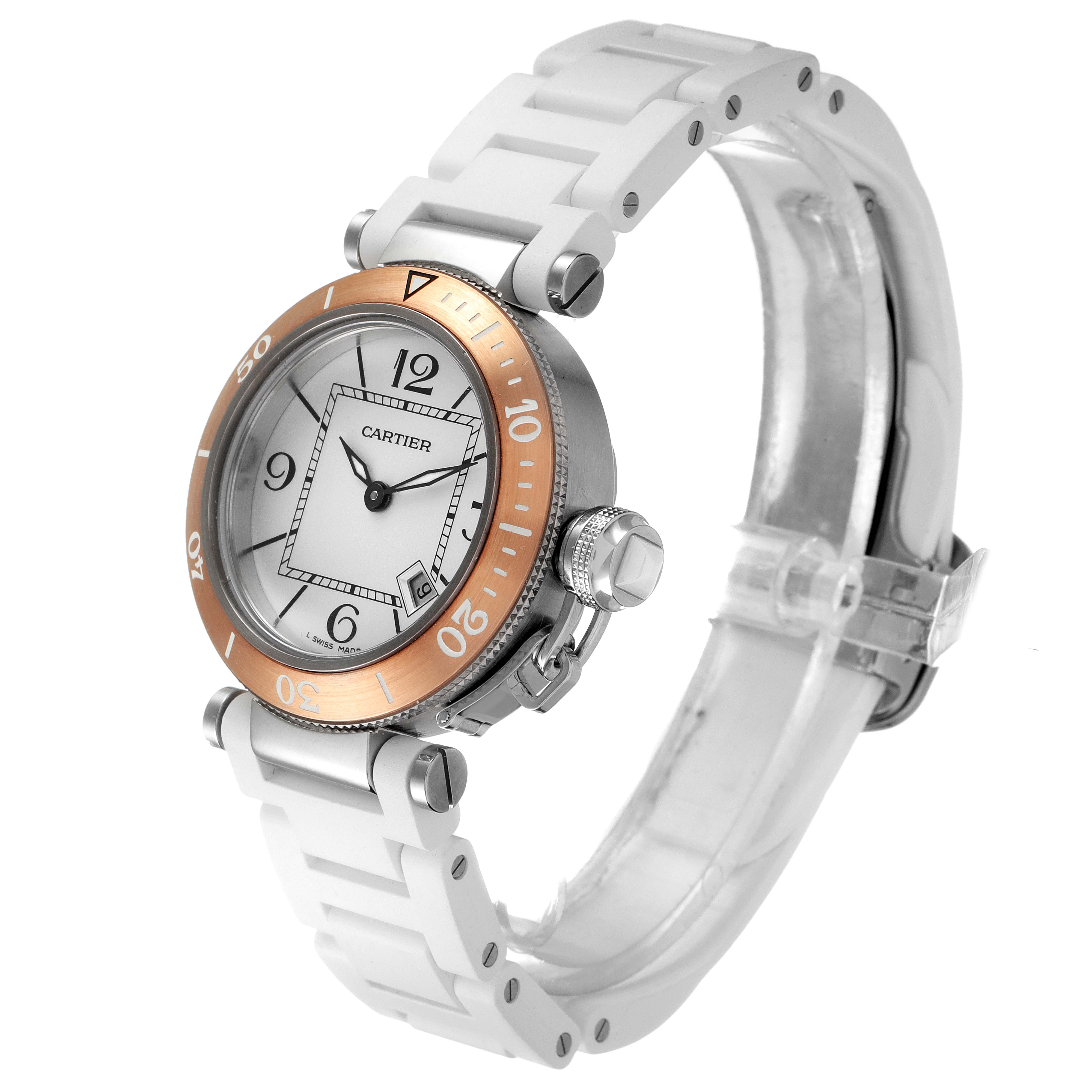 The Cartier Pasha W3140001 Women's Stainless Steel Silver Dial W3140001 Women's Stainless Steel Silver Dial watch is shown at a three-quarter angle, highlighting its white rubber strap, round dial, and rose gold bezel.