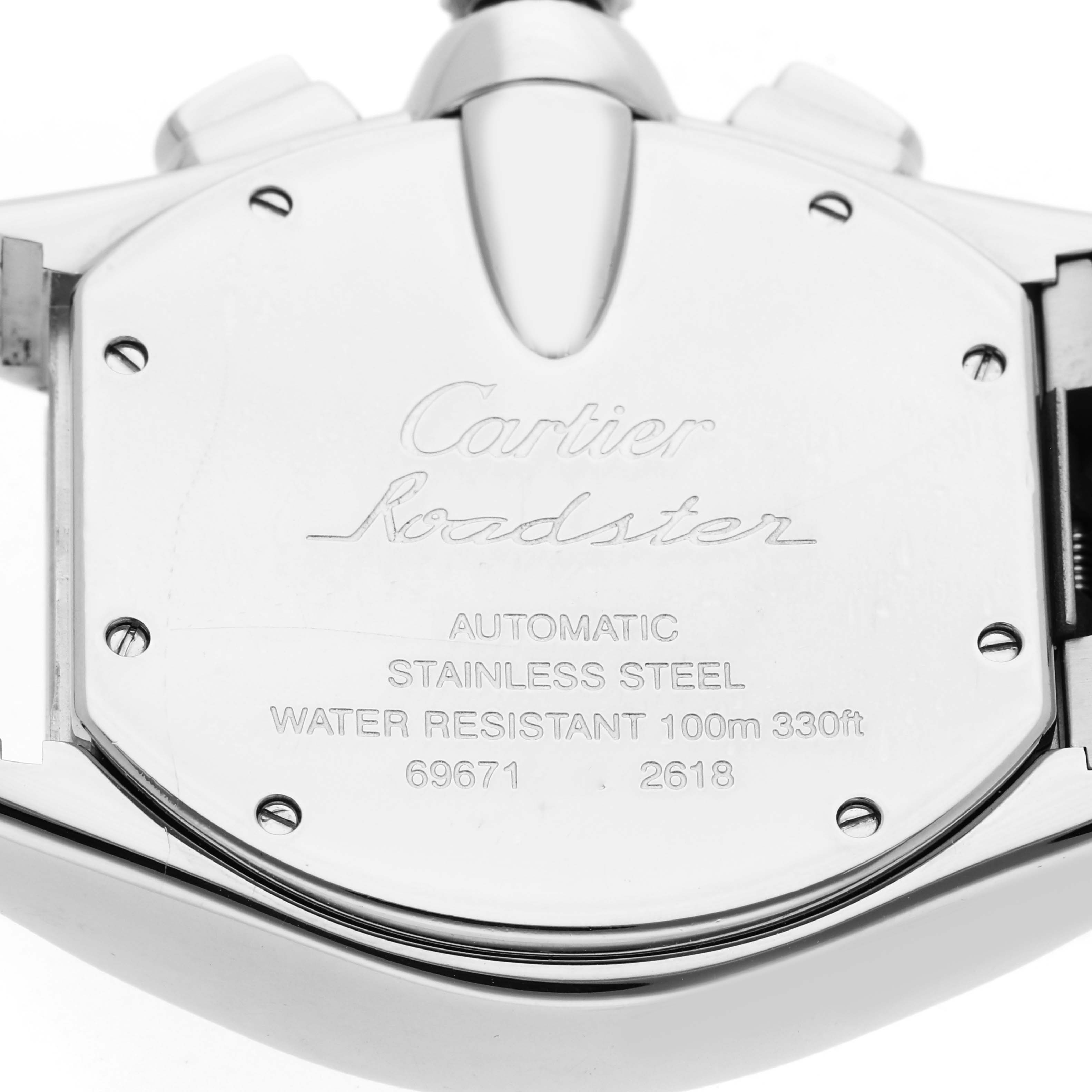 The image shows the back of a Cartier Roadster W62020X6 Men
s Stainless Steel Black Dial W62020X6 Men
s Stainless Steel Black Dial watch, highlighting engravings and screws.