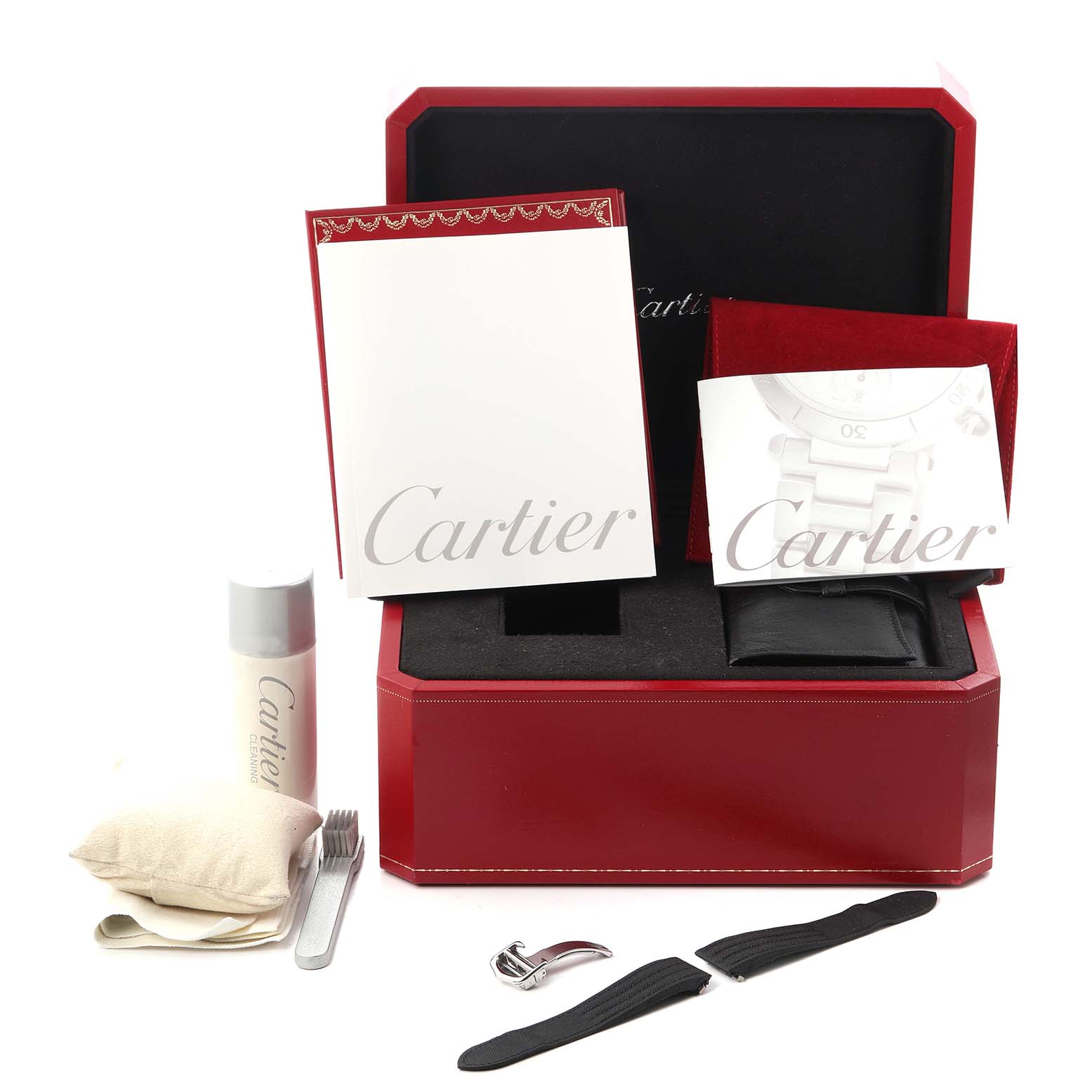 The image shows the Cartier Roadster W62020X6 Men
s Stainless Steel Black Dial W62020X6 Men
s Stainless Steel Black Dial watch accessories, including a red box, documents, strap pieces, and cleaning items.