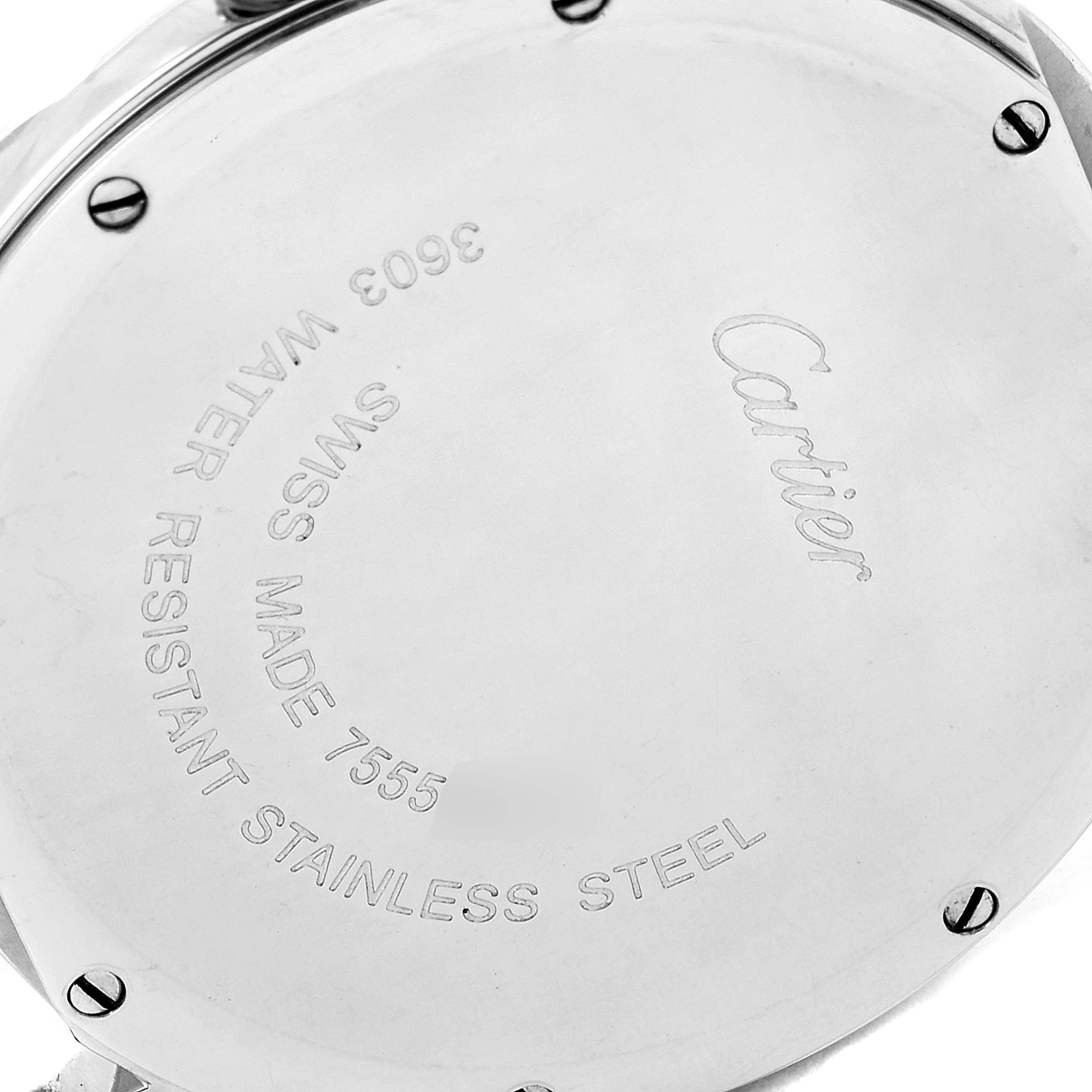 The image shows the case back of a Cartier Ronde W6701005 Men
s Stainless Steel Silver Dial W6701005 Men
s Stainless Steel Silver Dial watch in a close-up angle, highlighting the brand engravings and screws.