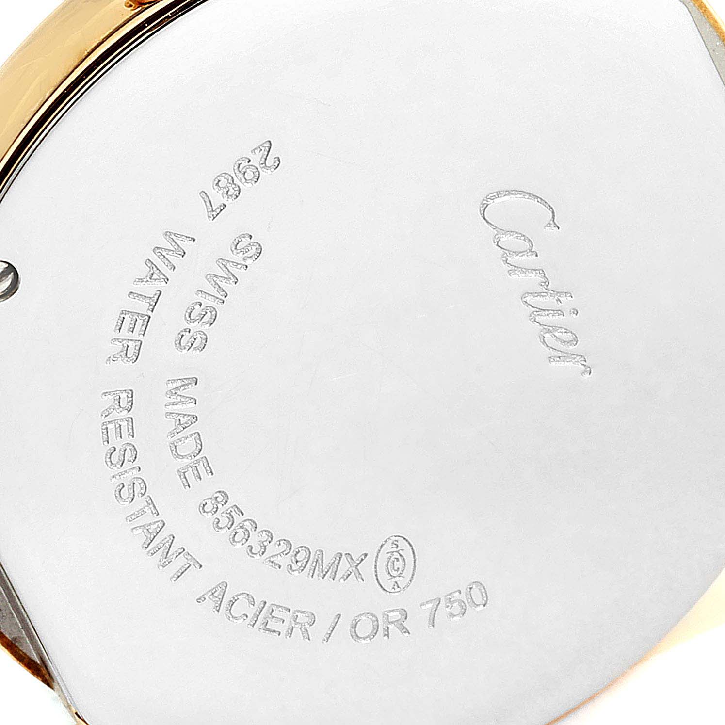 This image shows the back case of a Ronde model watch by Cartier, displaying engravings and markings.