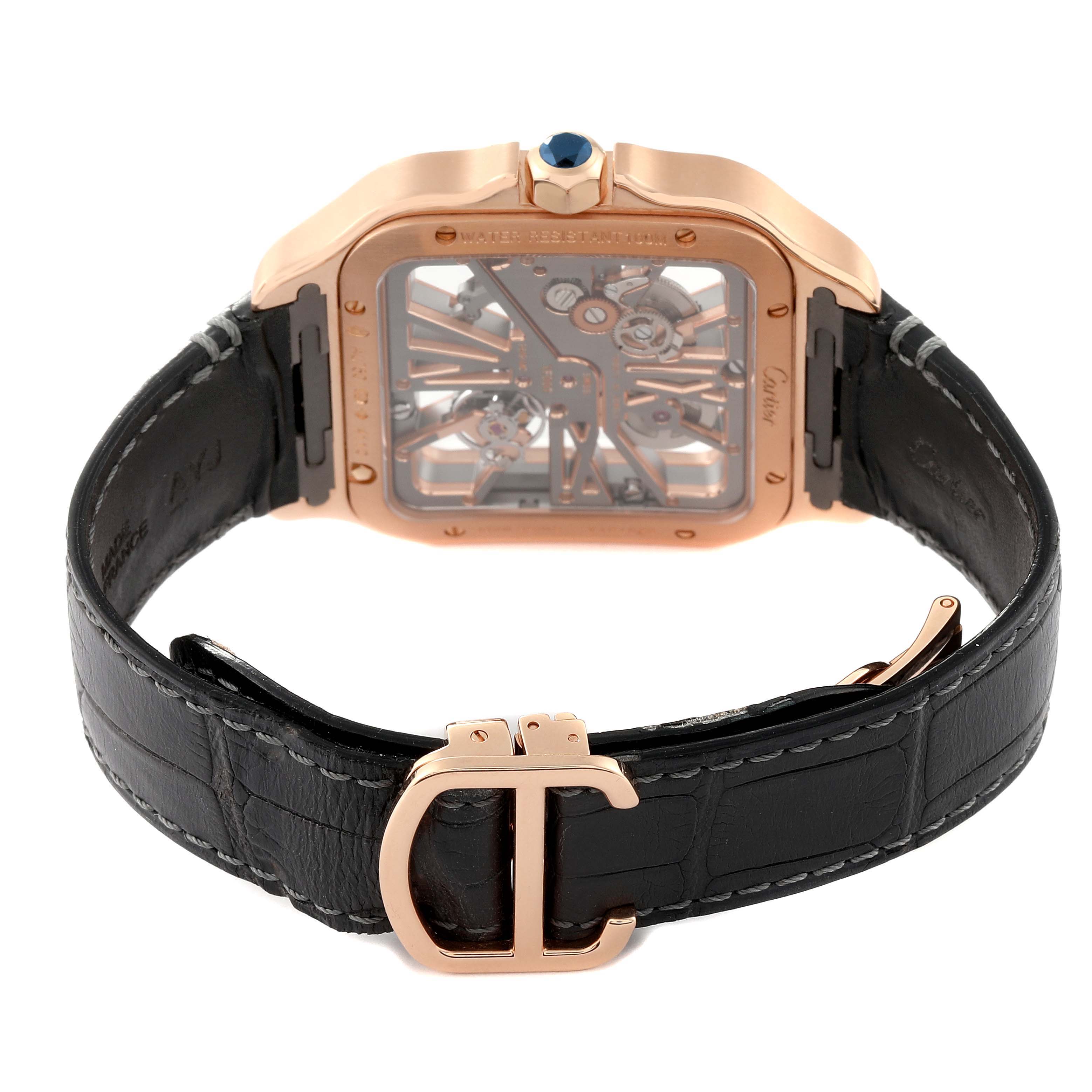 The image shows the back view of a Cartier Santos WHSA0010 Men's Rose Gold Transparent Dial WHSA0010 Men's Rose Gold Transparent Dial watch, highlighting the movement, case, strap, and buckle.