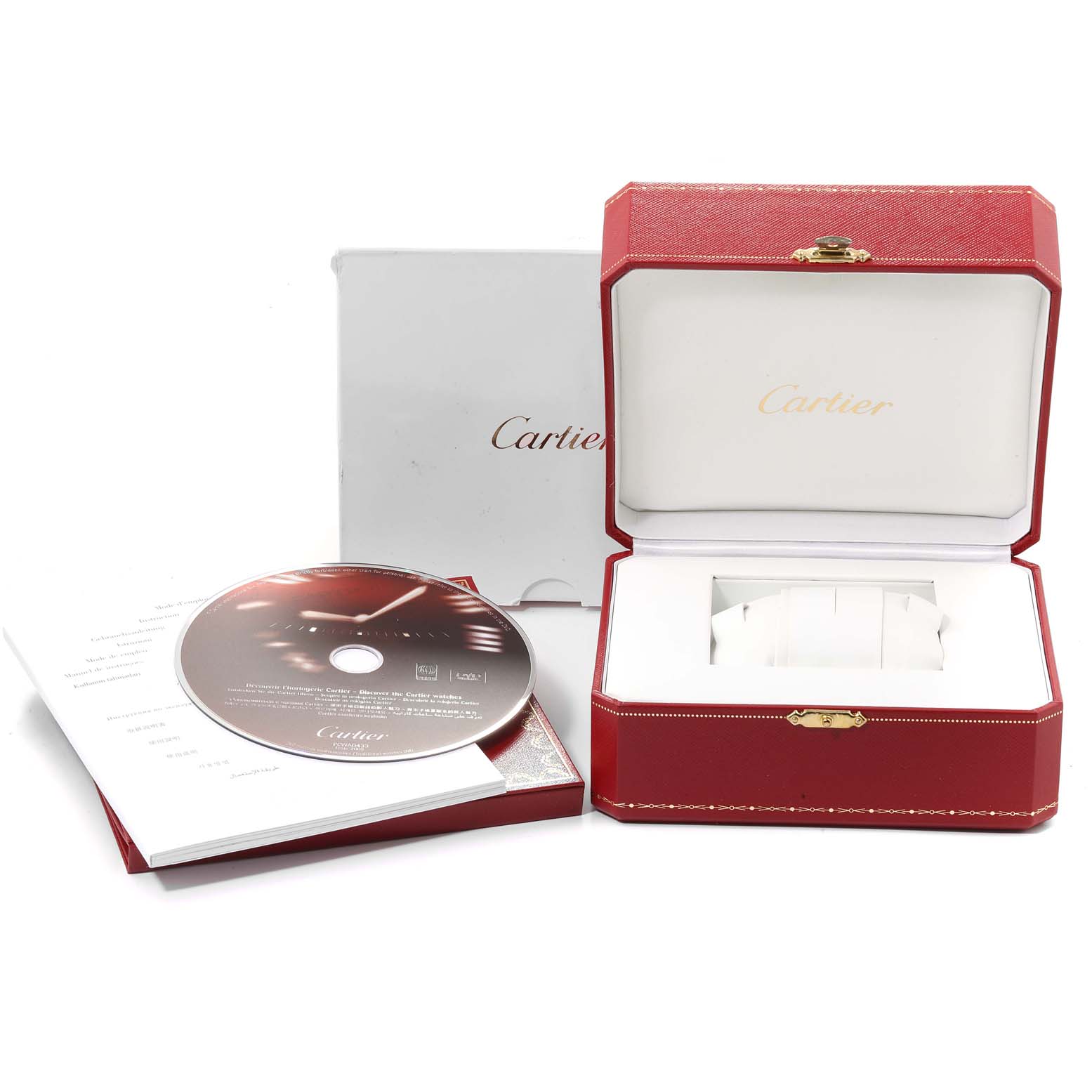 The image shows the packaging and accessories of a Cartier Tank Americaine W2603256 Men's White Gold Silver Dial W2603256 Men's White Gold Silver Dial watch, including a red box, a CD, and documentation.