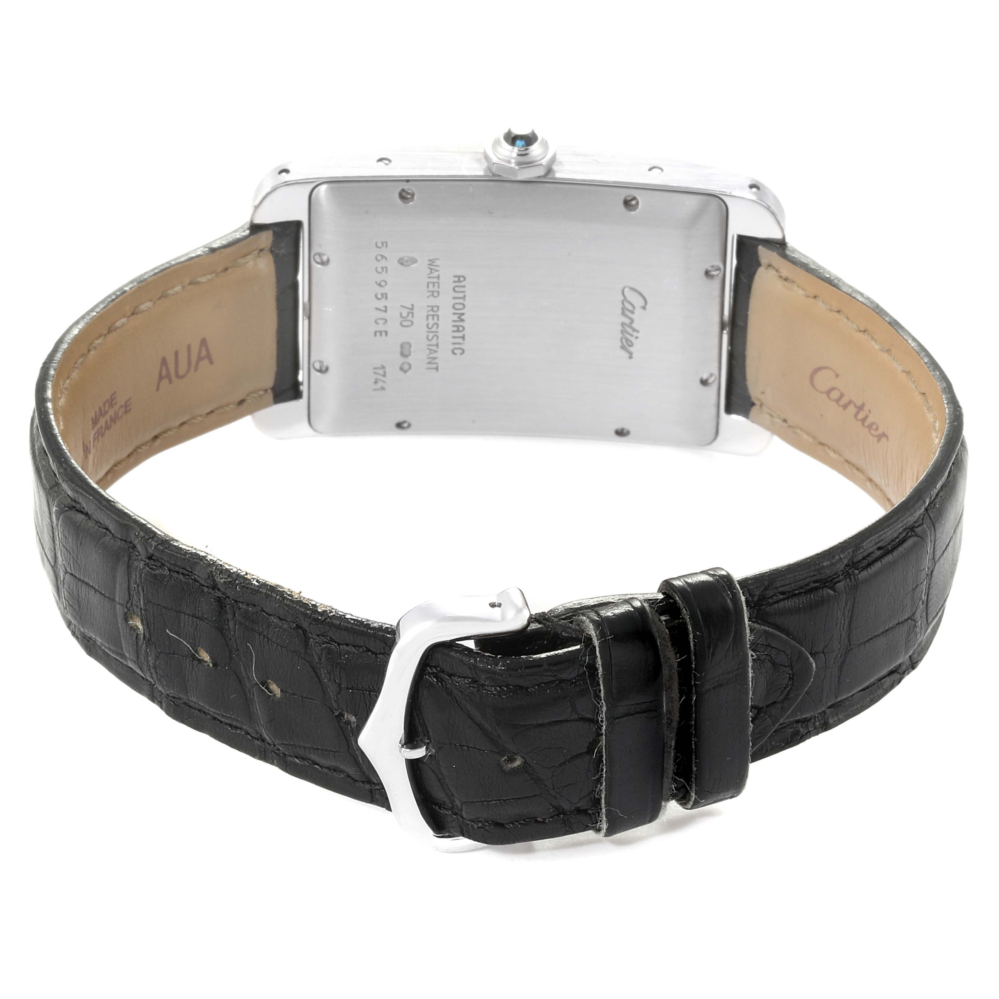 The image shows the back and leather strap of a Cartier Tank Americaine W2603256 Men's White Gold Silver Dial W2603256 Men's White Gold Silver Dial watch, highlighting its buckle and case back inscriptions.