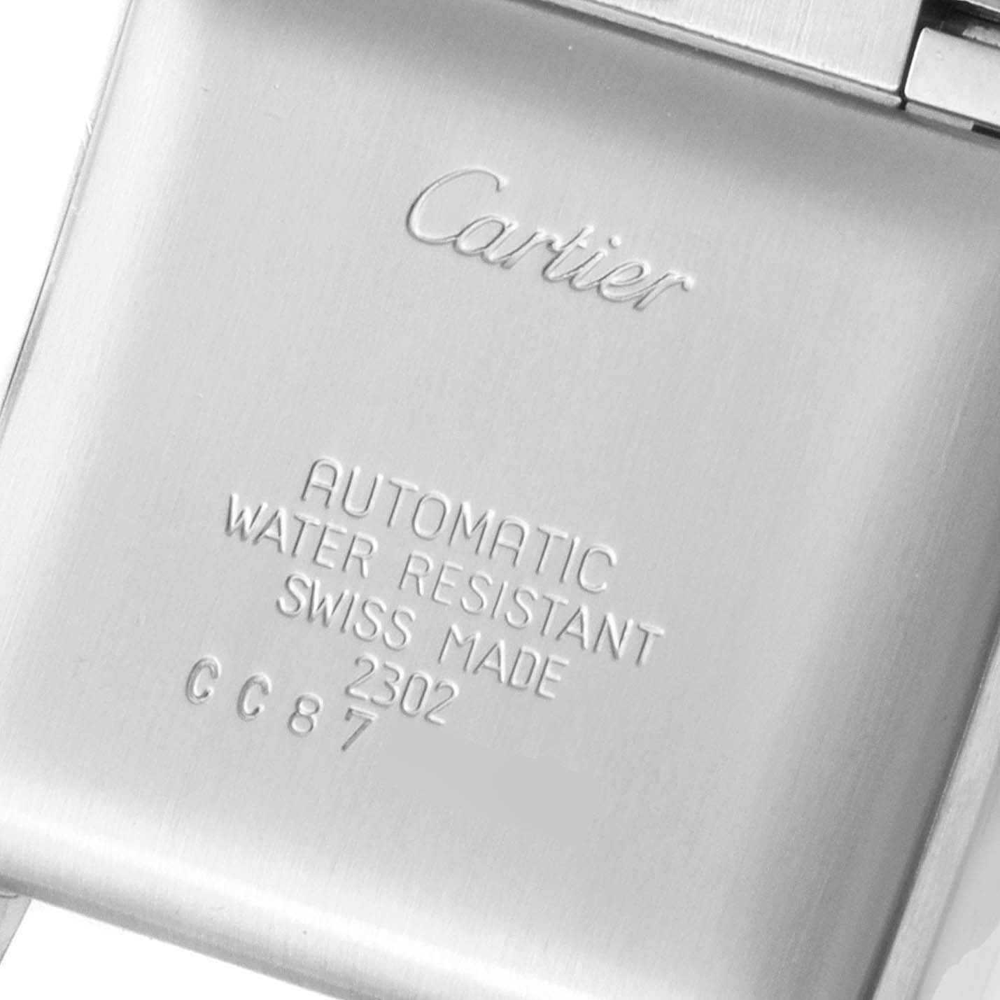 This image shows the back case of a Cartier Tank Francaise W51002Q3 Men's Stainless Steel Silver Dial W51002Q3 Men's Stainless Steel Silver Dial watch with engravings indicating automatic movement and water resistance.