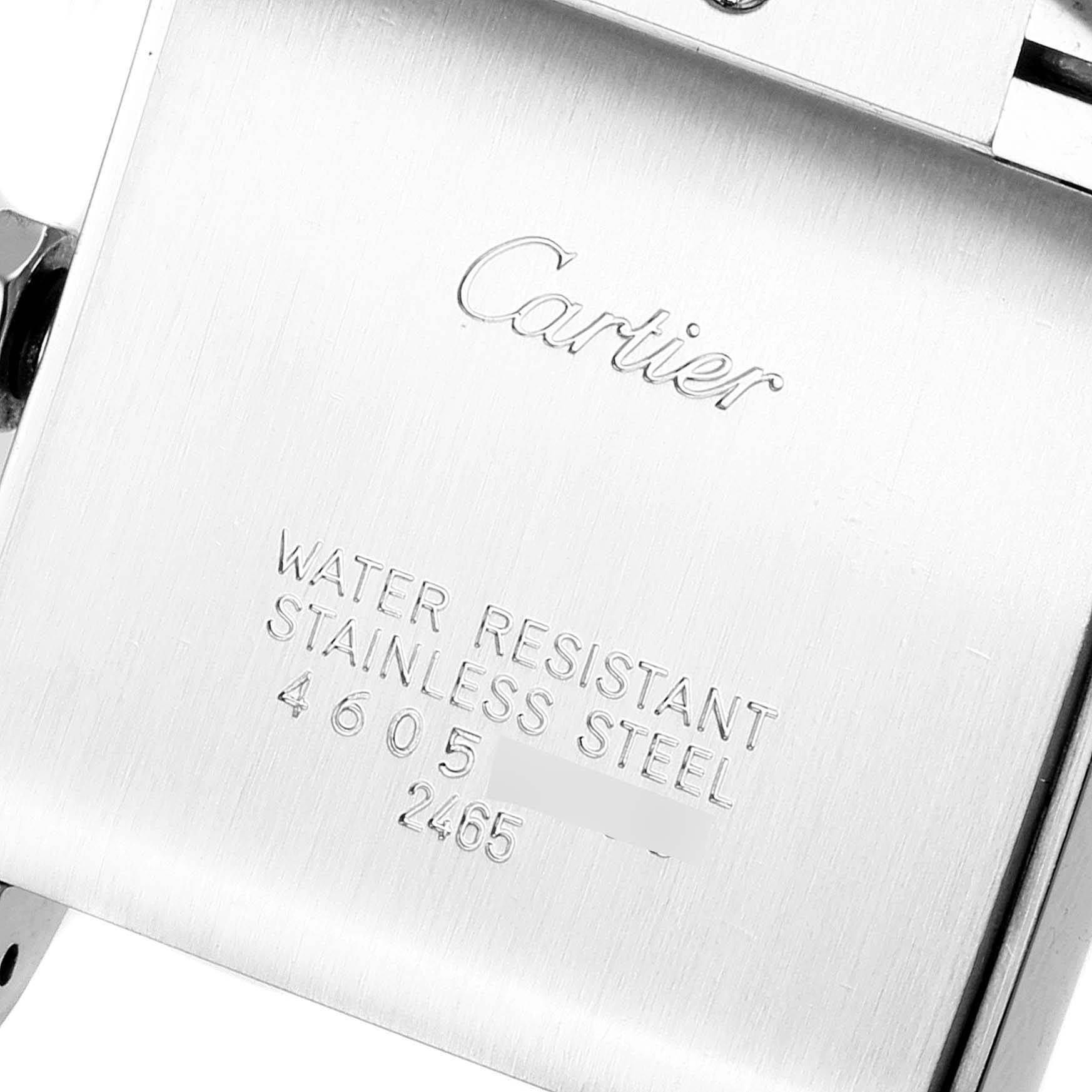 The image shows the engraved case back of a Cartier Tank Francaise W51011Q3 Women's Stainless Steel Silver Dial W51011Q3 Women's Stainless Steel Silver Dial watch, highlighting its water resistance and stainless steel material.