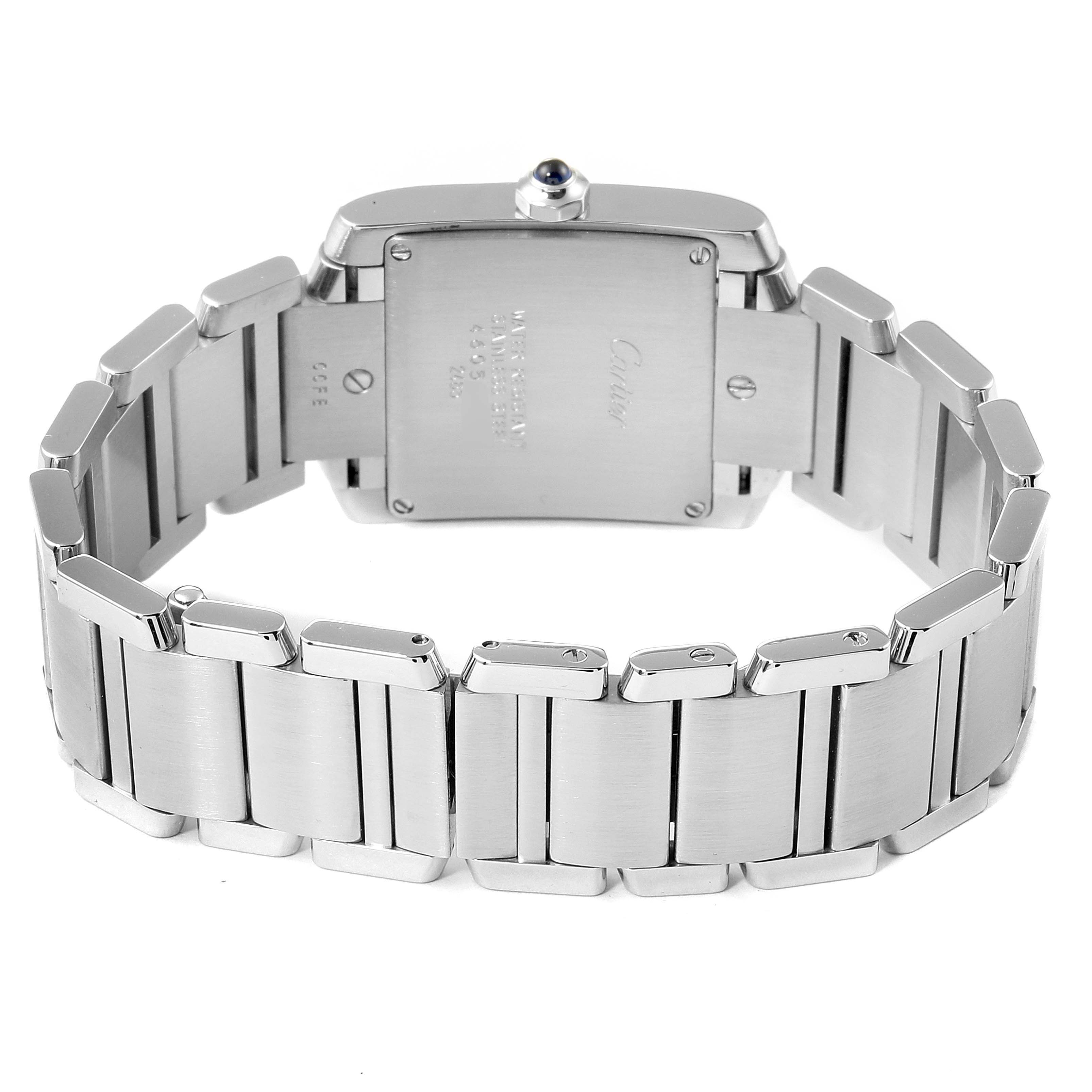 The image shows the back view of a Cartier Tank Française watch, highlighting its case and stainless steel bracelet.