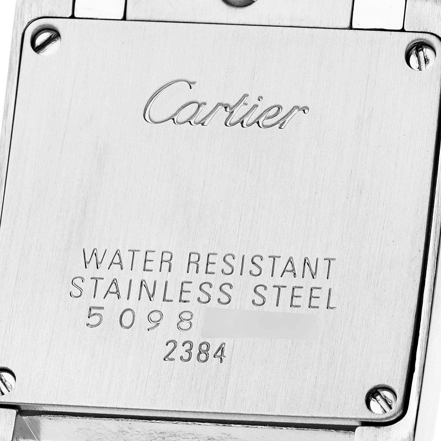 The image shows the stainless steel case back of a Cartier Tank Francaise W51008Q3 Women
s Stainless Steel Silver Dial W51008Q3 Women
s Stainless Steel Silver Dial watch with engraved details about water resistance and materials.