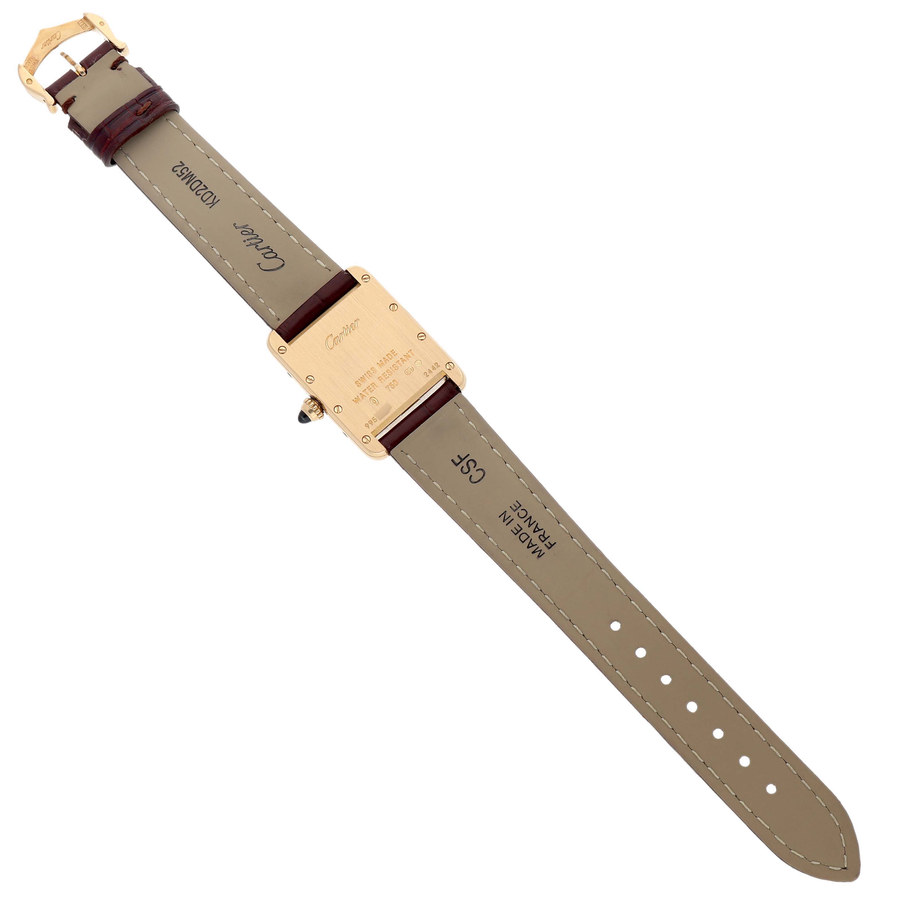 The image shows the back of a Cartier Tank Louis W1529856 Men's Yellow Gold Silver Dial watch, detailing the case back, strap, and buckle.