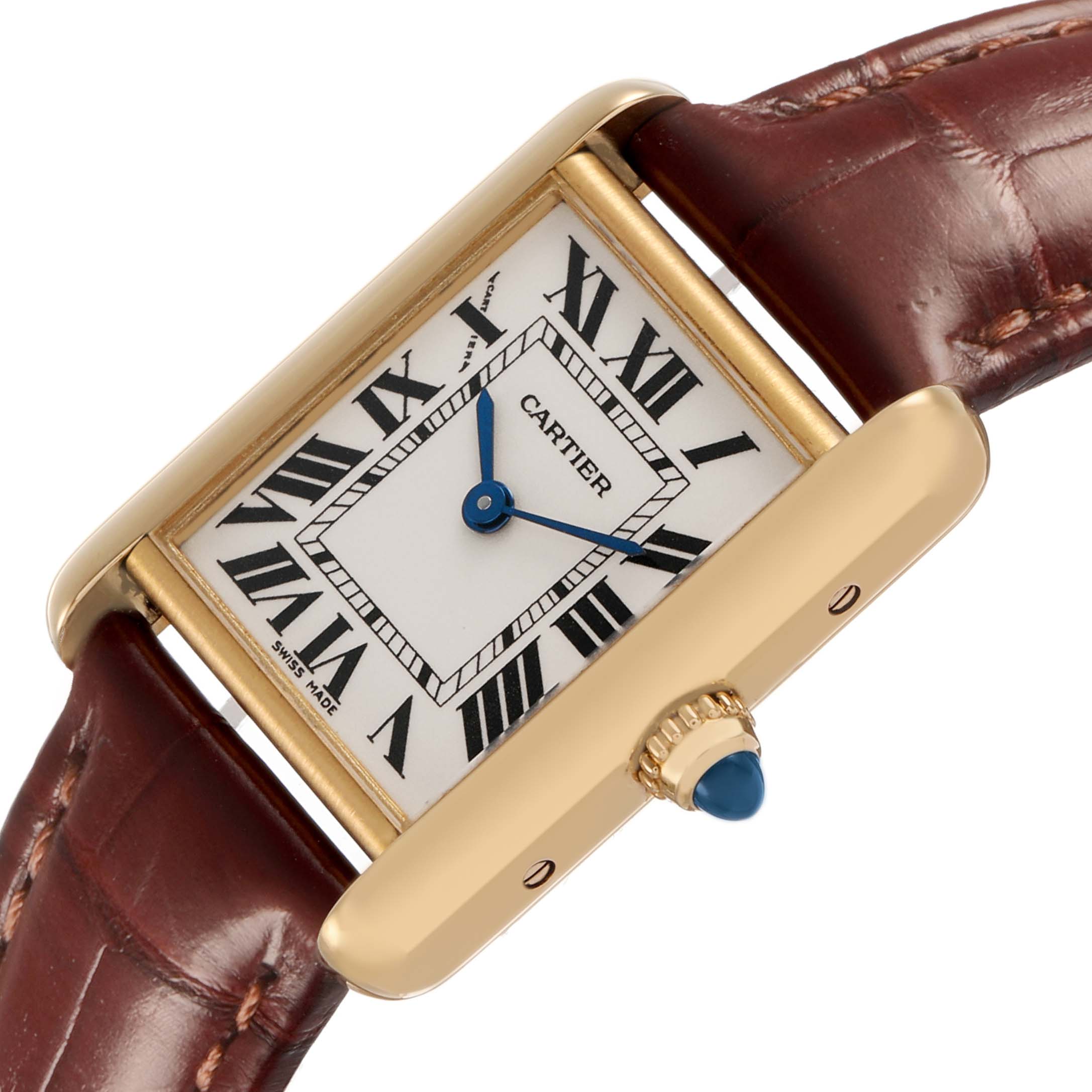The Cartier Tank Louis W1529856 Men's Yellow Gold Silver Dial watch is shown at an angled close-up, featuring the case, dial with Roman numerals, blue hands, and strap.