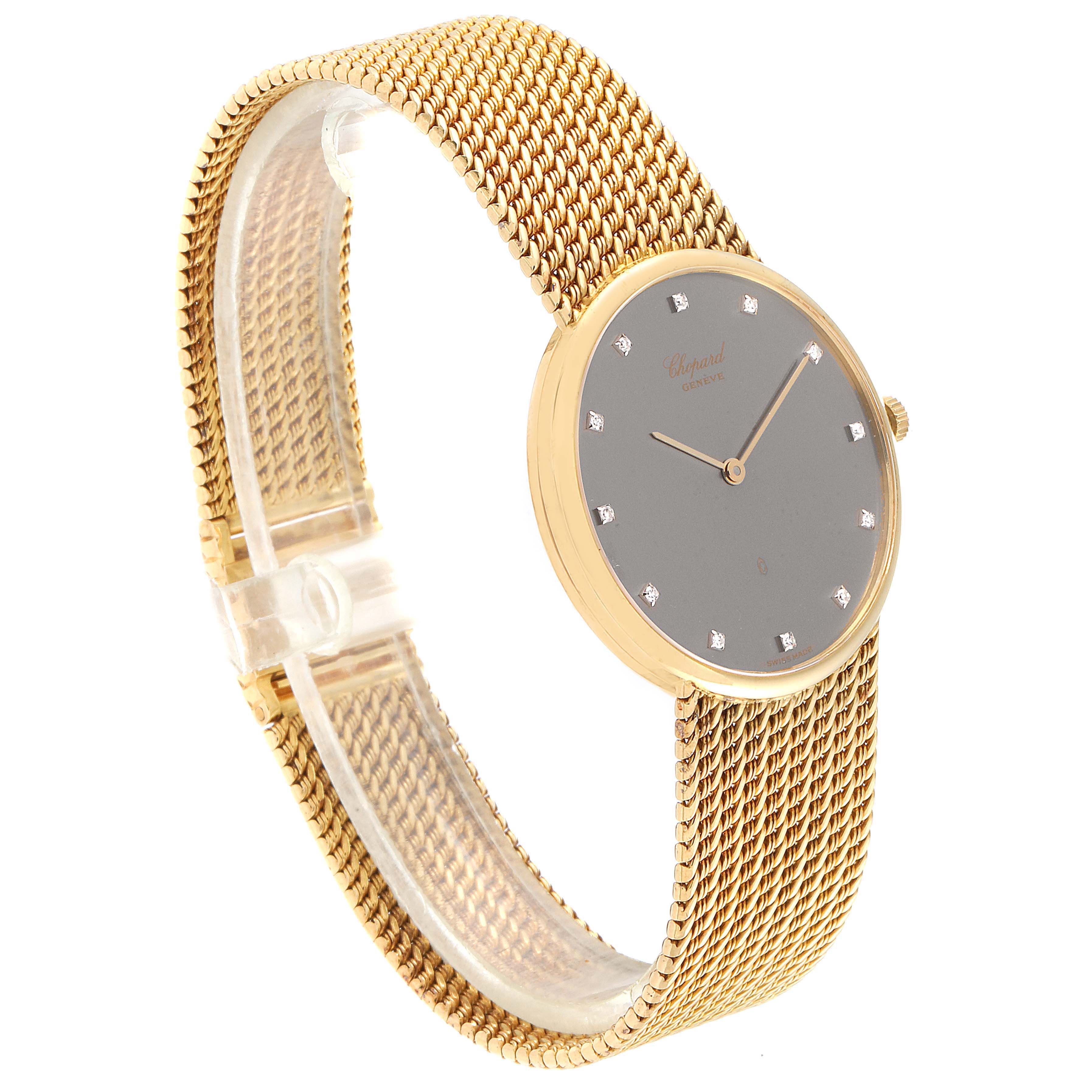 The Chopard Classique 1091 Men
s Yellow Gold Grey Dial 1091 Men
s Yellow Gold Grey Dial watch is shown at a slight angle, displaying the watch face, dial, and stainless steel mesh strap.