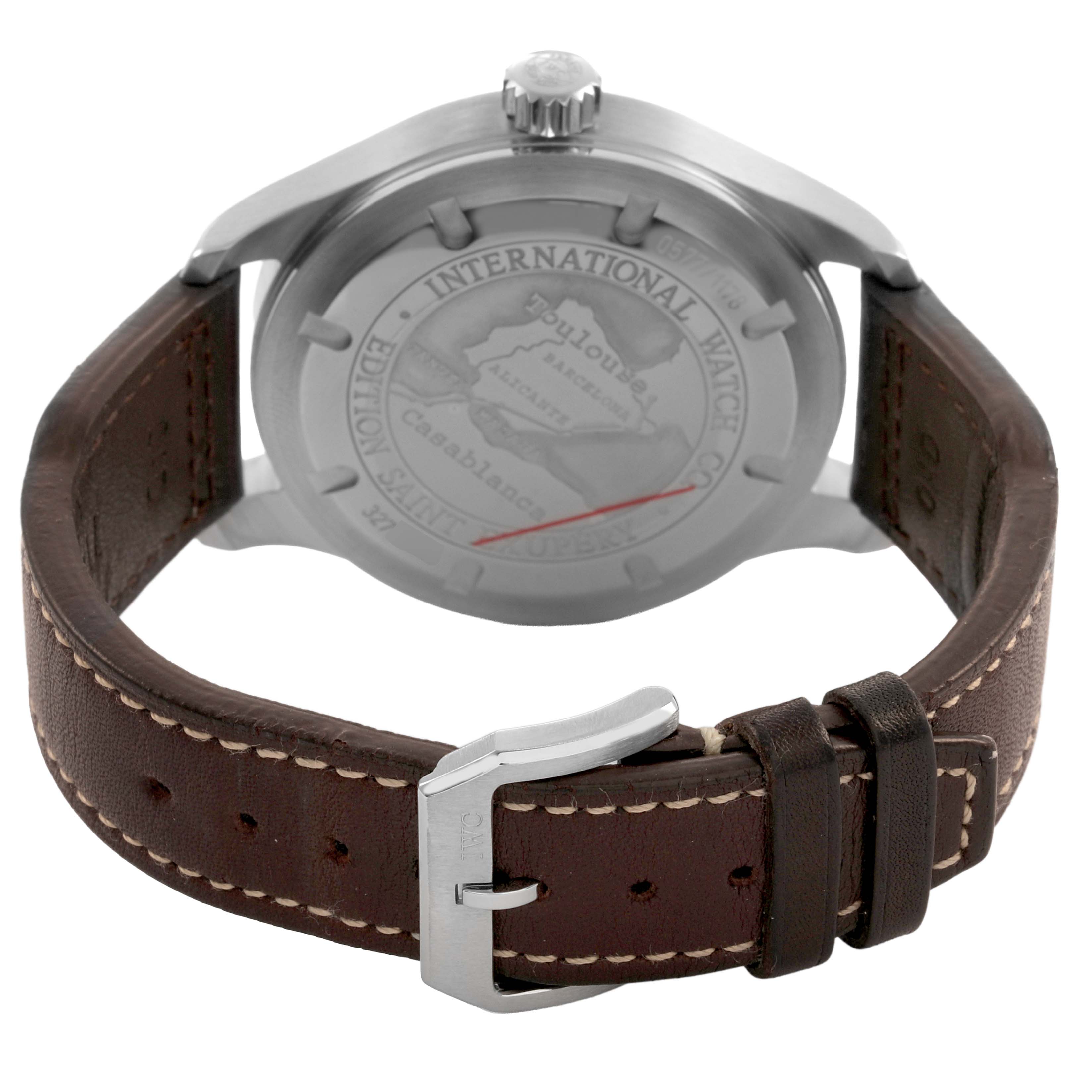 The image shows the back view of an IWC Pilot IW320104 Men's Stainless Steel Brown Dial watch, highlighting the case back, crown, and leather strap with a buckle.