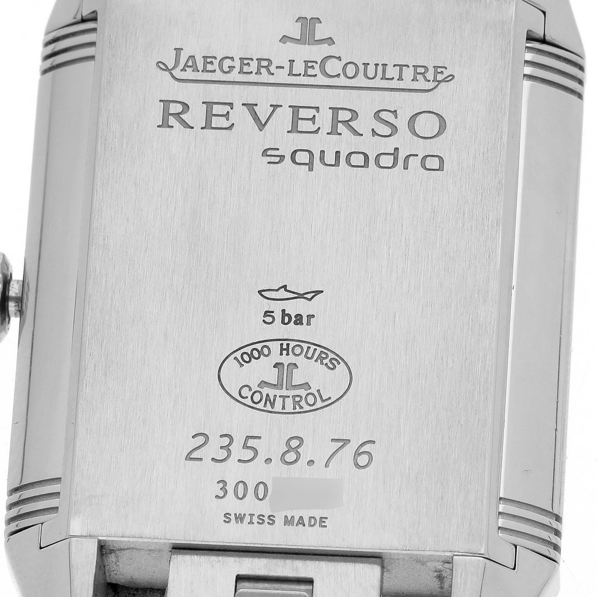 This image shows the back of the Jaeger-LeCoultre Reverso watch, featuring engravings and the model details.