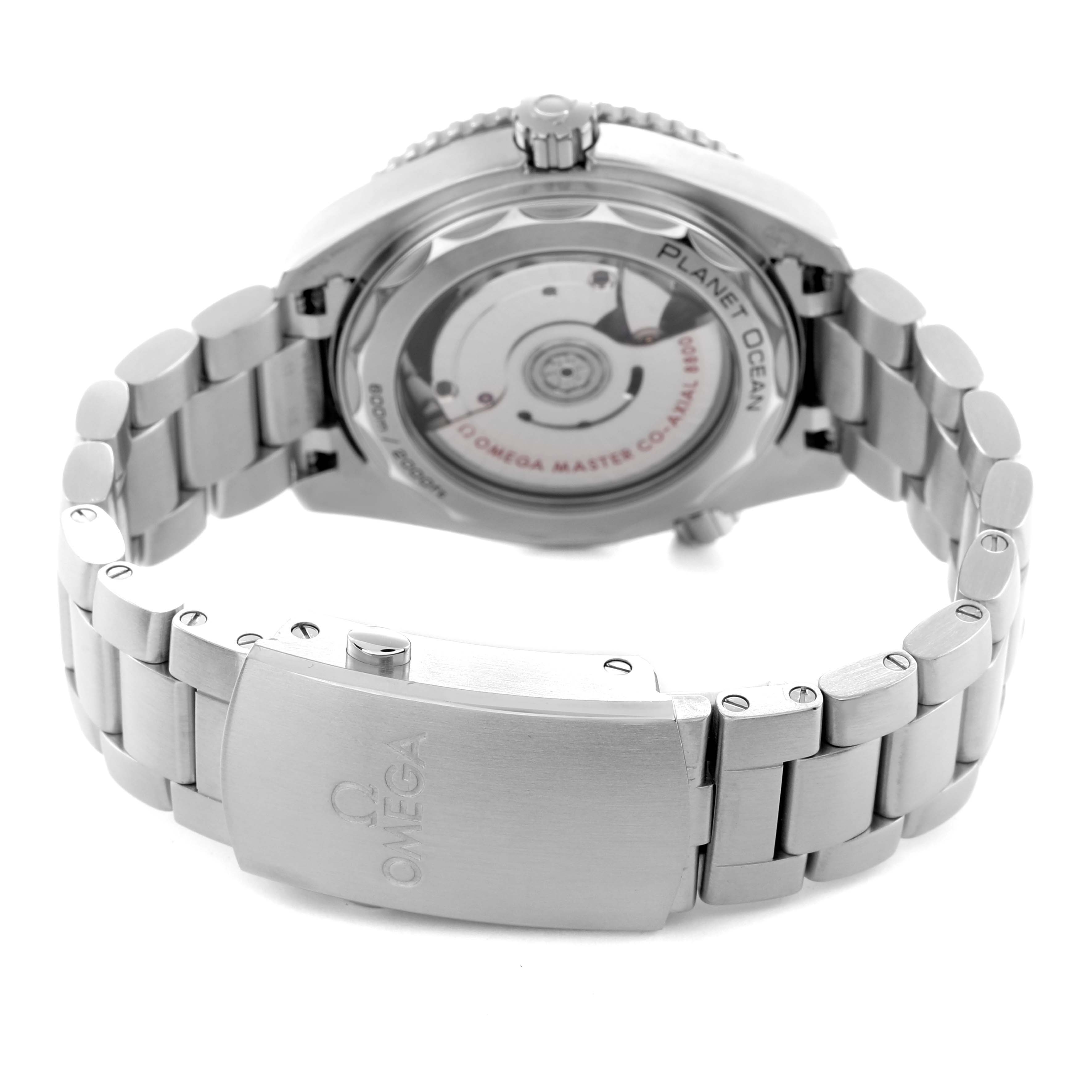 The image shows the back of the Omega Planet Ocean 215.30.40.20.01.001 Men
s Stainless Steel Black Dial 215.30.40.20.01.001 Men
s Stainless Steel Black Dial watch and its metal bracelet, with a clear view of the movement through the case back.