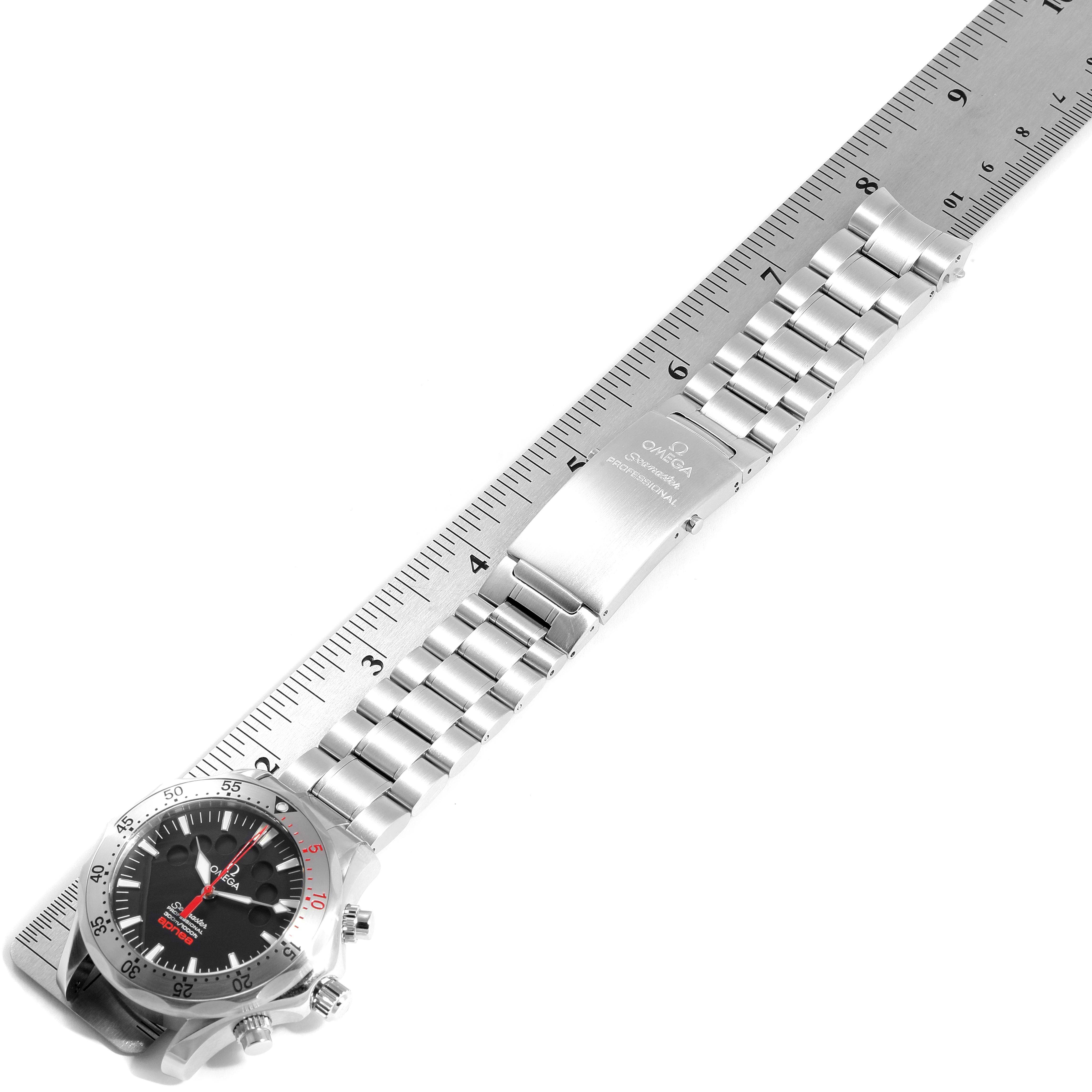 The Omega Seamaster 2595.50.00 Men's Stainless Steel Black Dial 2595.50.00 Men's Stainless Steel Black Dial watch is shown from a top-down angle, displaying its face and metal bracelet placed alongside a ruler.