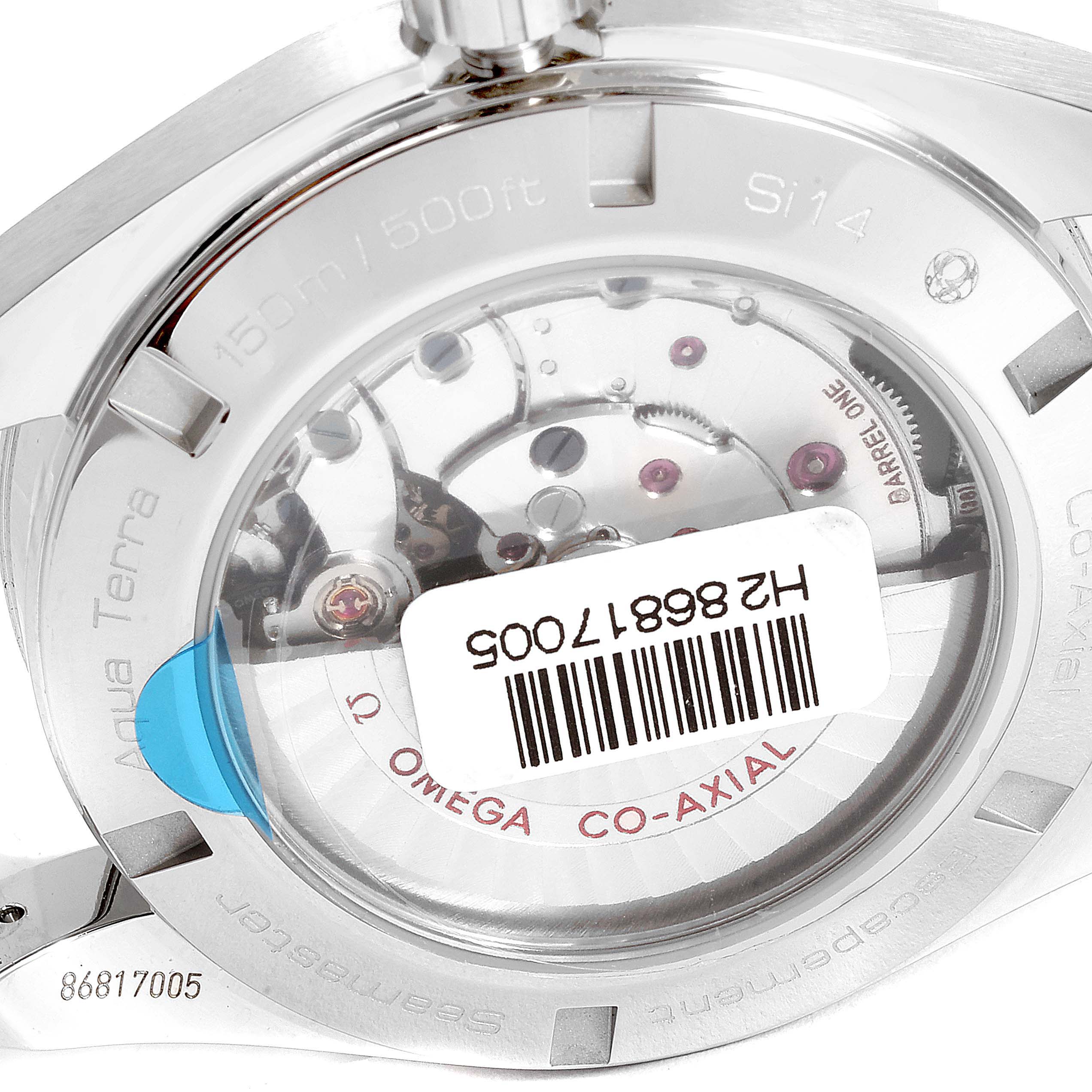 The image shows the back of an Omega Aqua Terra 231.13.43.22.01.001  Men's Stainless Steel Black Dial 231.13.43.22.01.001  Men's Stainless Steel Black Dial watch, highlighting its internal mechanisms and branding.