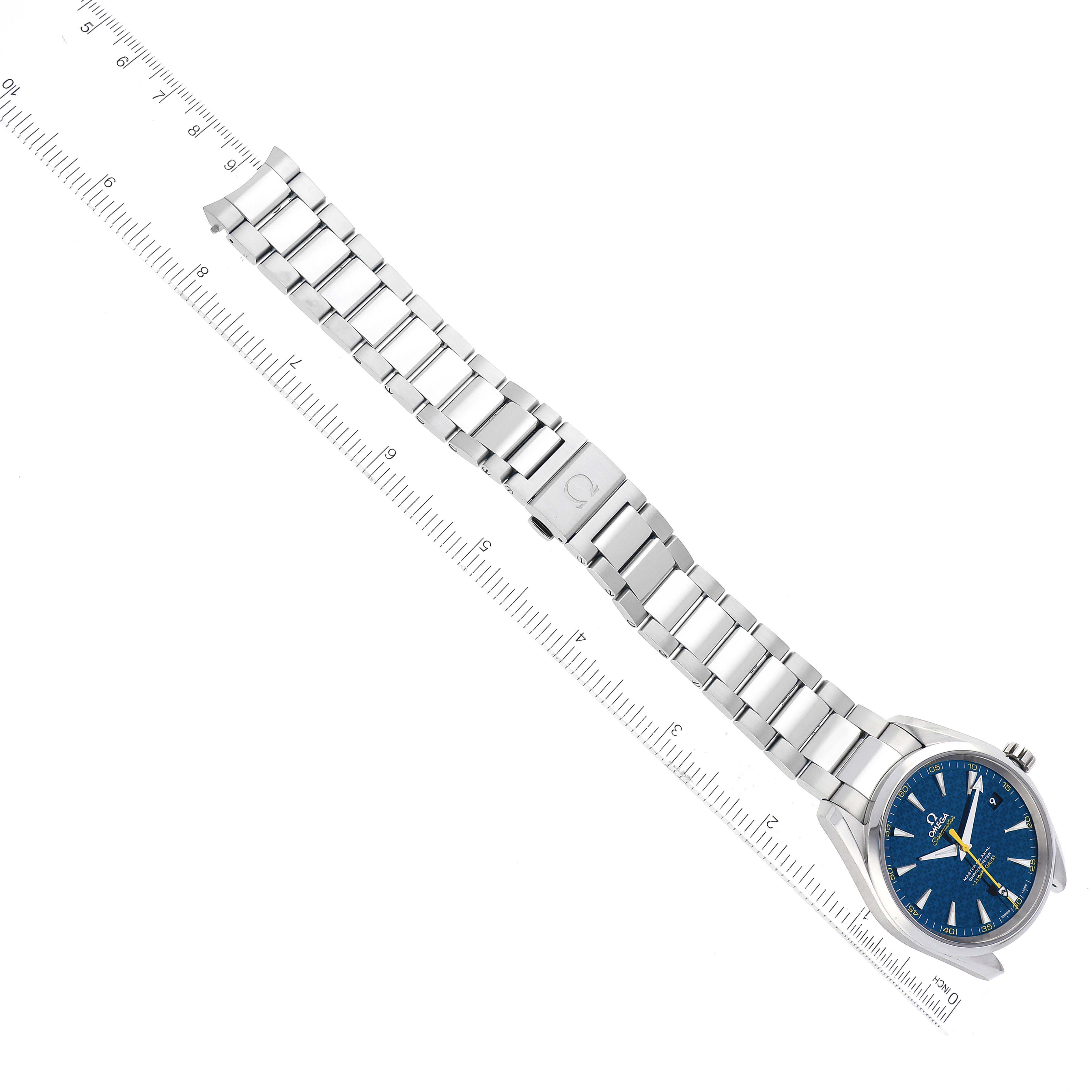 The image shows an Omega Aqua Terra 231.10.42.21.03.004 Men's Stainless Steel Blue Dial 231.10.42.21.03.004 Men's Stainless Steel Blue Dial watch lying flat, displaying the bracelet and blue dial with a ruler for scale.