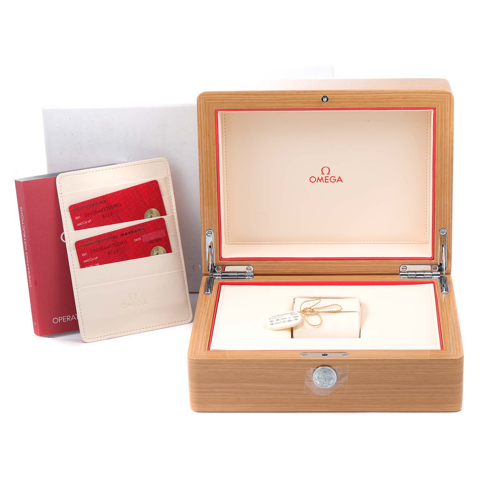 The image shows an Omega Planet Ocean 232.30.44.22.01.001 Men
s Stainless Steel Black Dial 232.30.44.22.01.001 Men
s Stainless Steel Black Dial watch box, warranty cards, and booklet from a front angle.