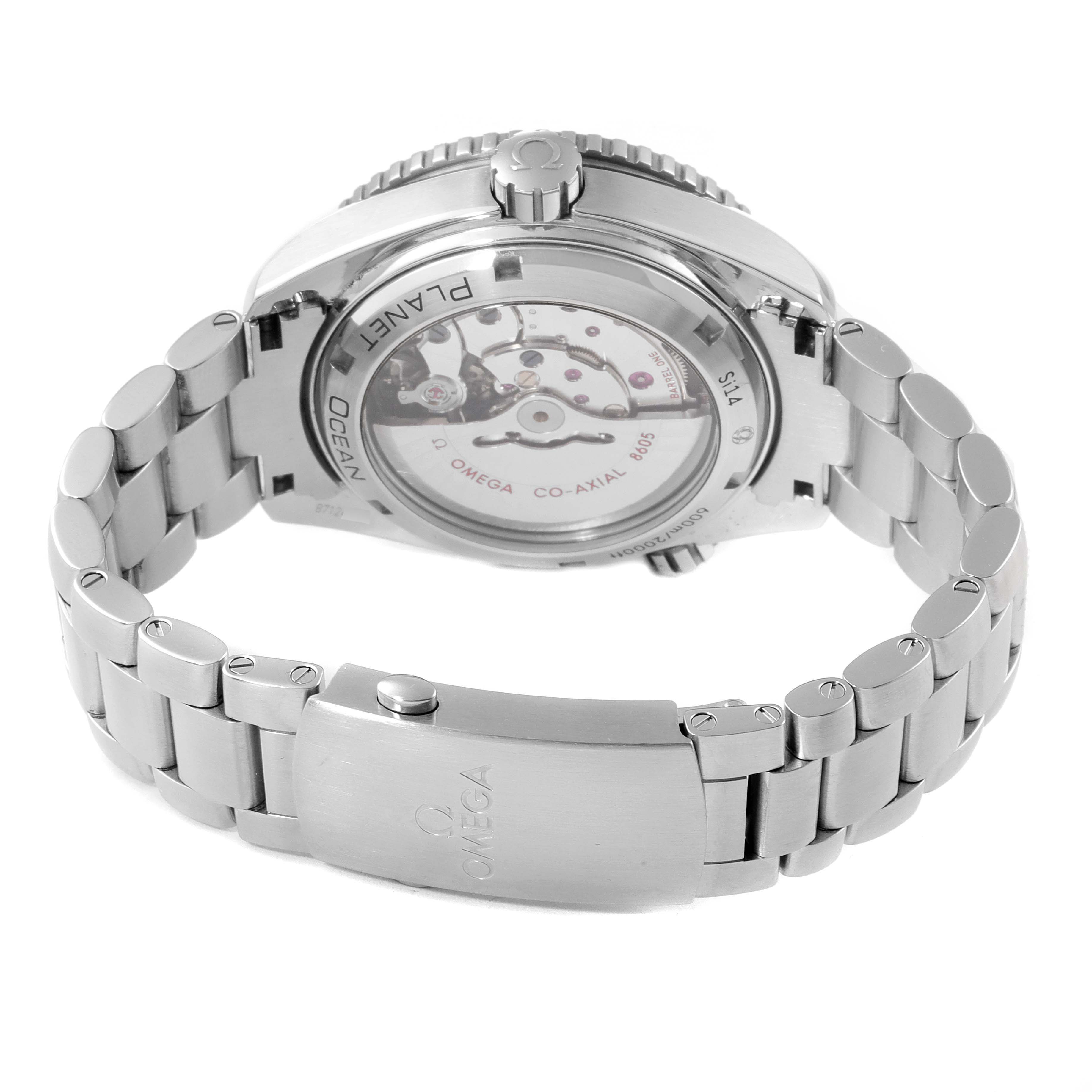 The image shows the back view of the Omega Planet Ocean 232.30.44.22.01.001 Men
s Stainless Steel Black Dial 232.30.44.22.01.001 Men
s Stainless Steel Black Dial watch, focusing on its open case back and stainless steel bracelet.