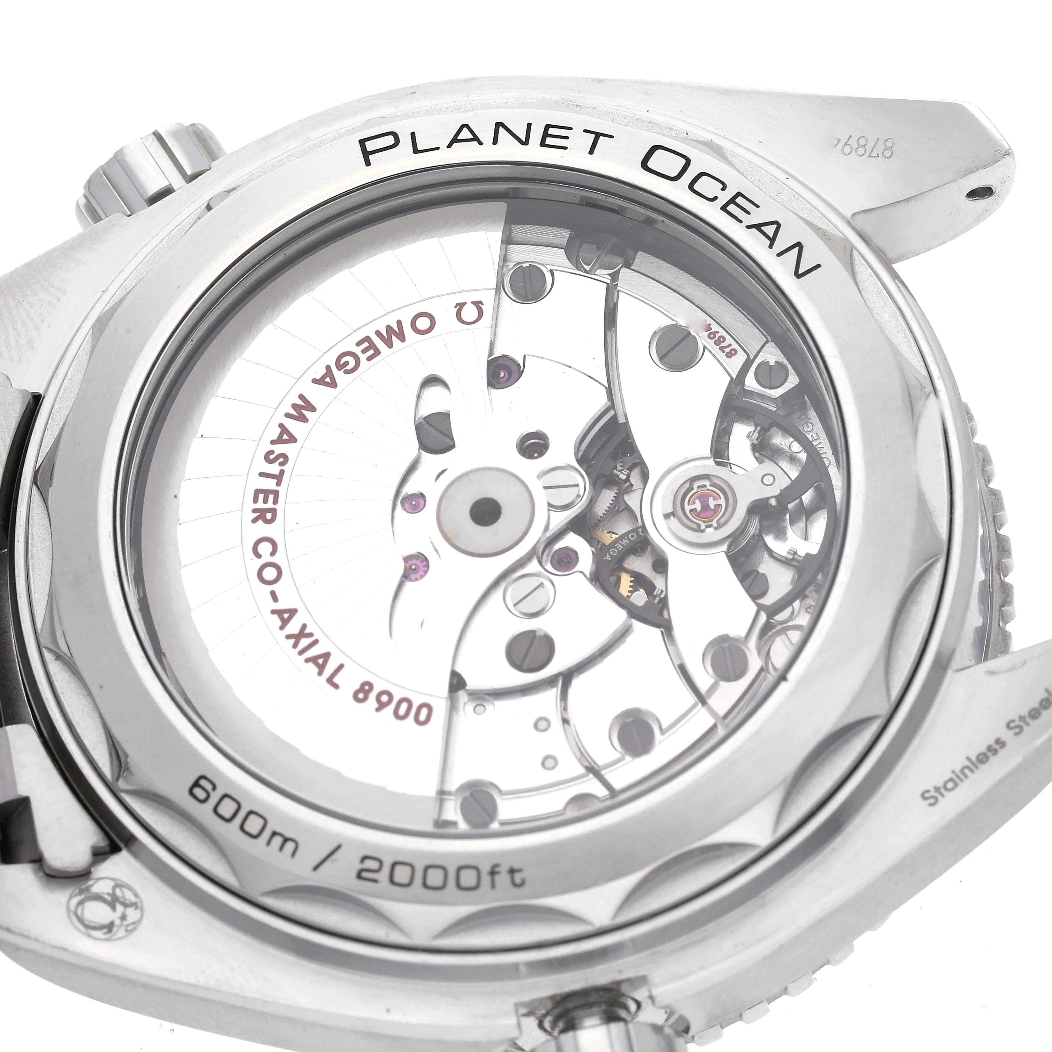 The image shows the back of the Omega Planet Ocean 215.30.44.21.03.001 Men's Stainless Steel Blue Dial 215.30.44.21.03.001 Men's Stainless Steel Blue Dial watch, highlighting its transparent case back and internal movement mechanisms.